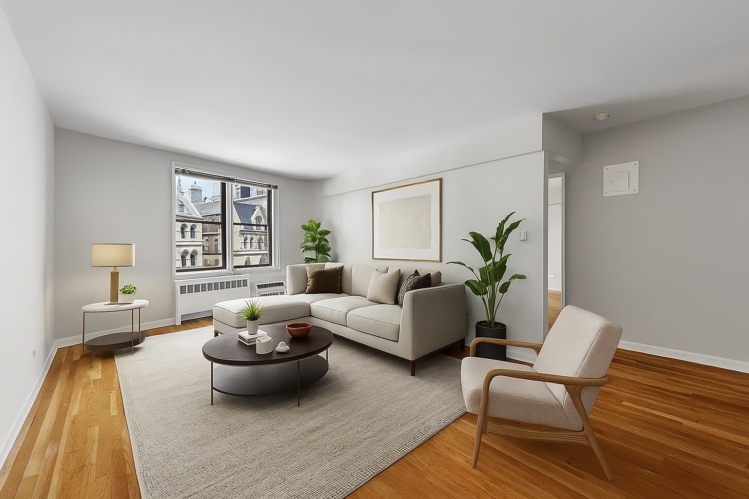 85 4th Avenue, Unit 4EE Manhattan, NY 10003 - Photo 1 of 7 a living room with furniture and a potted plant