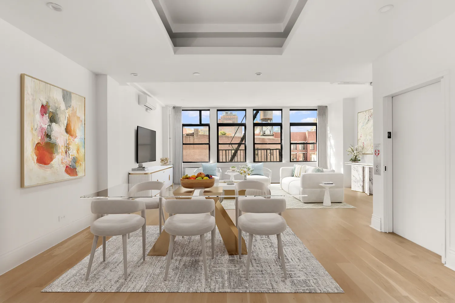 a living room with fireplace furniture and a rug