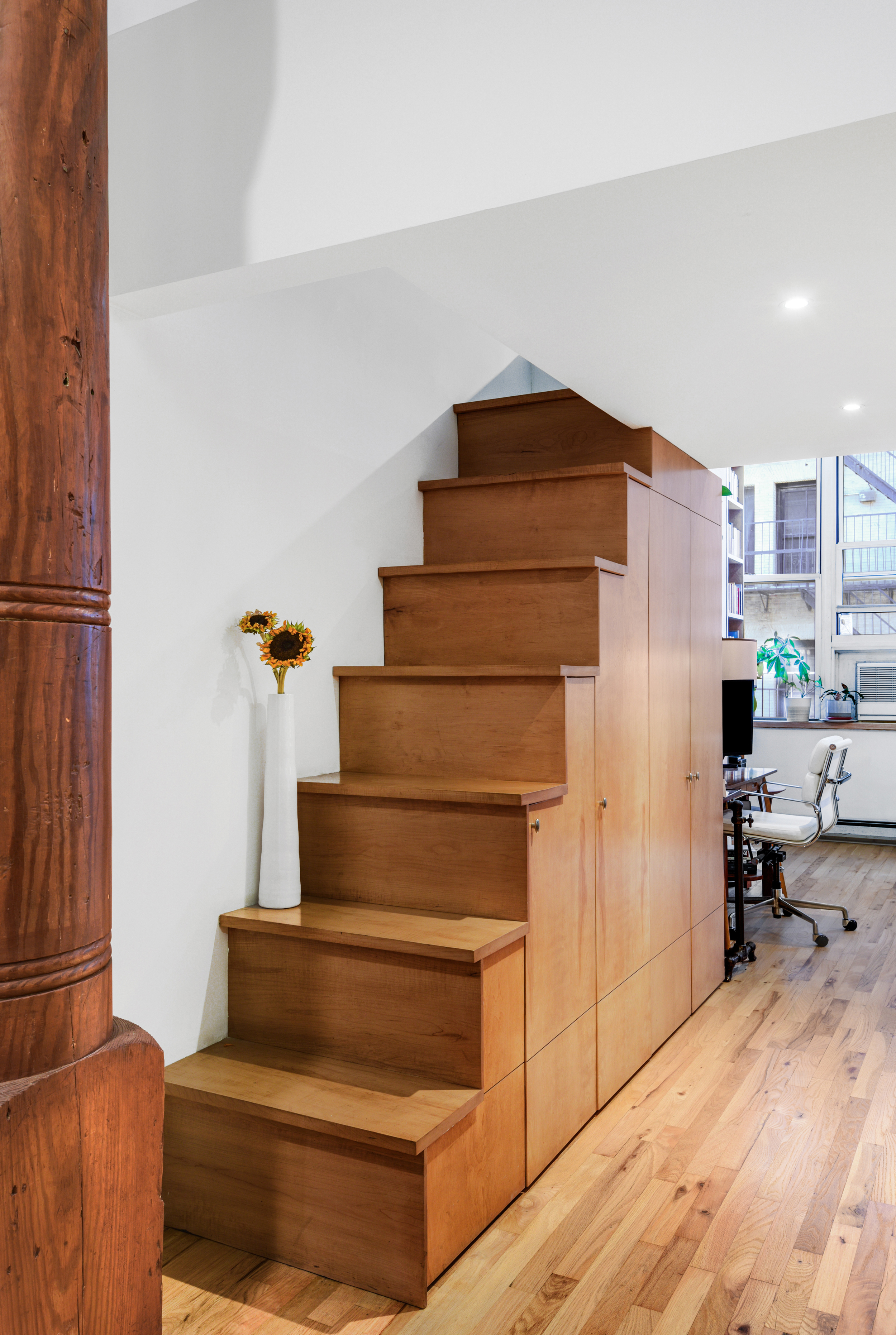 23 Waverly Place, Unit 5U Manhattan, NY 10003 - Photo 5 of 13 a living room with furniture and a fireplace