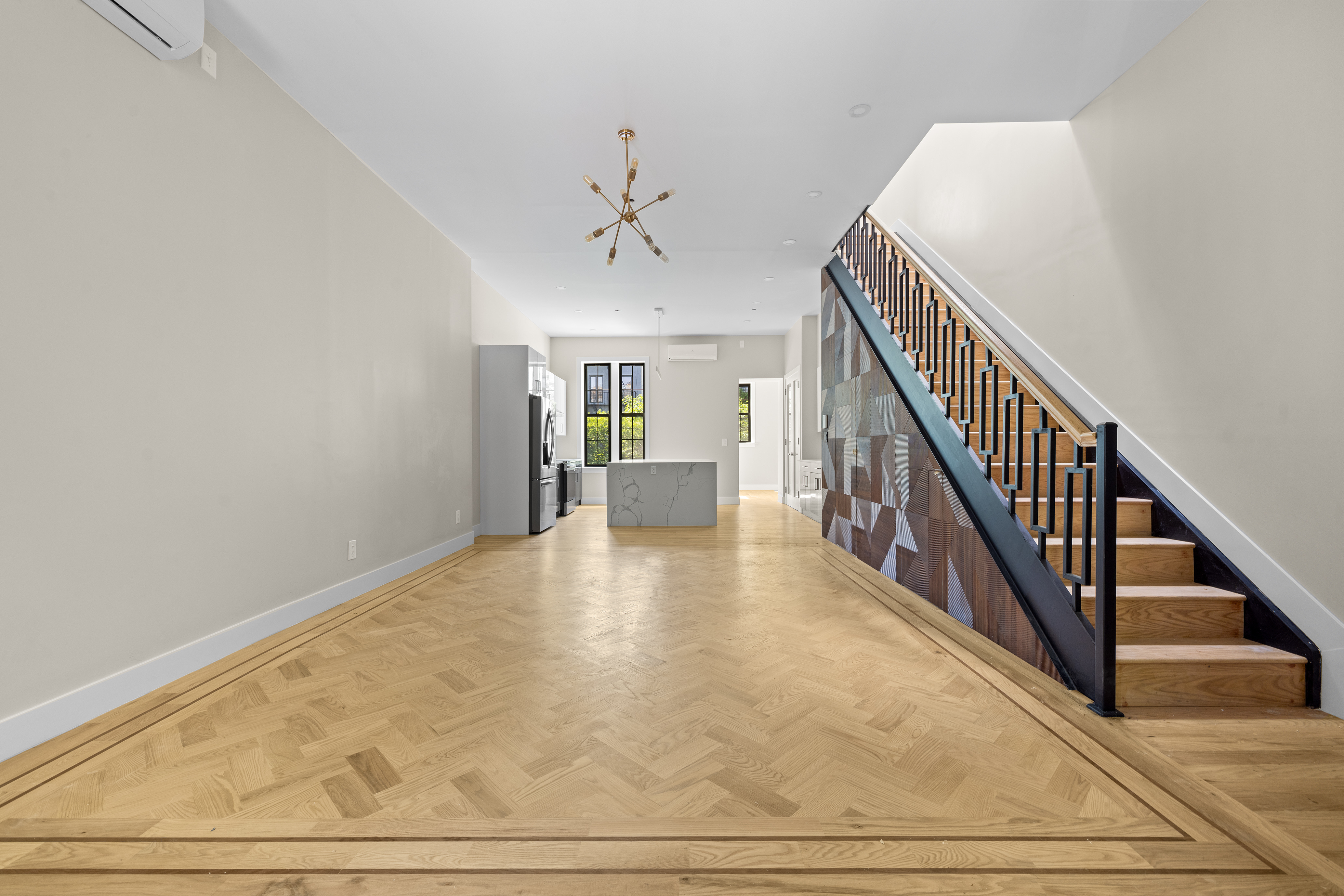 456 Willoughby Avenue, Unit 1 Brooklyn, NY 11206 - Photo 3 of 14 a view of a hallway with wooden floor and staircase