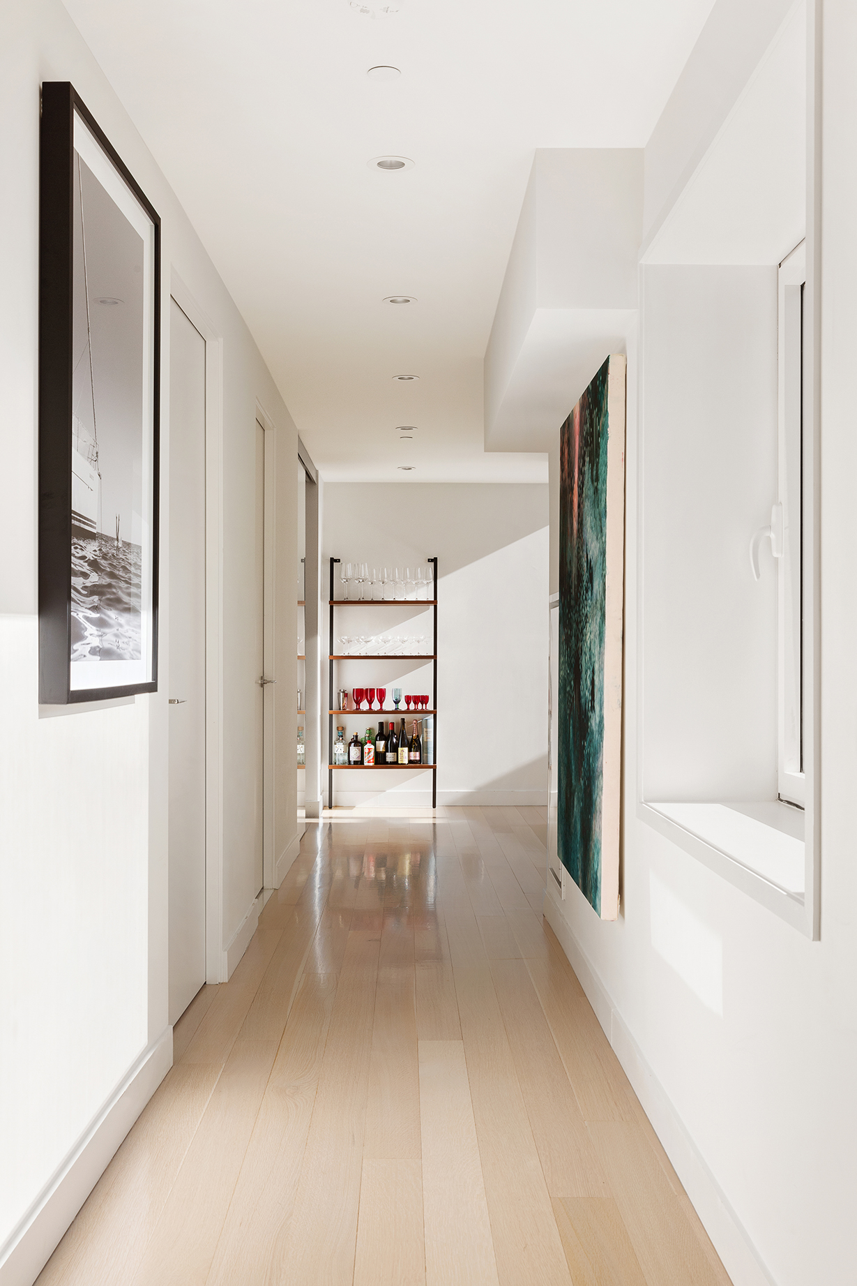 135 West 52nd Street, Unit PH3 Manhattan, NY 10019 - Photo 16 of 17 a view of a hallway with a livingroom