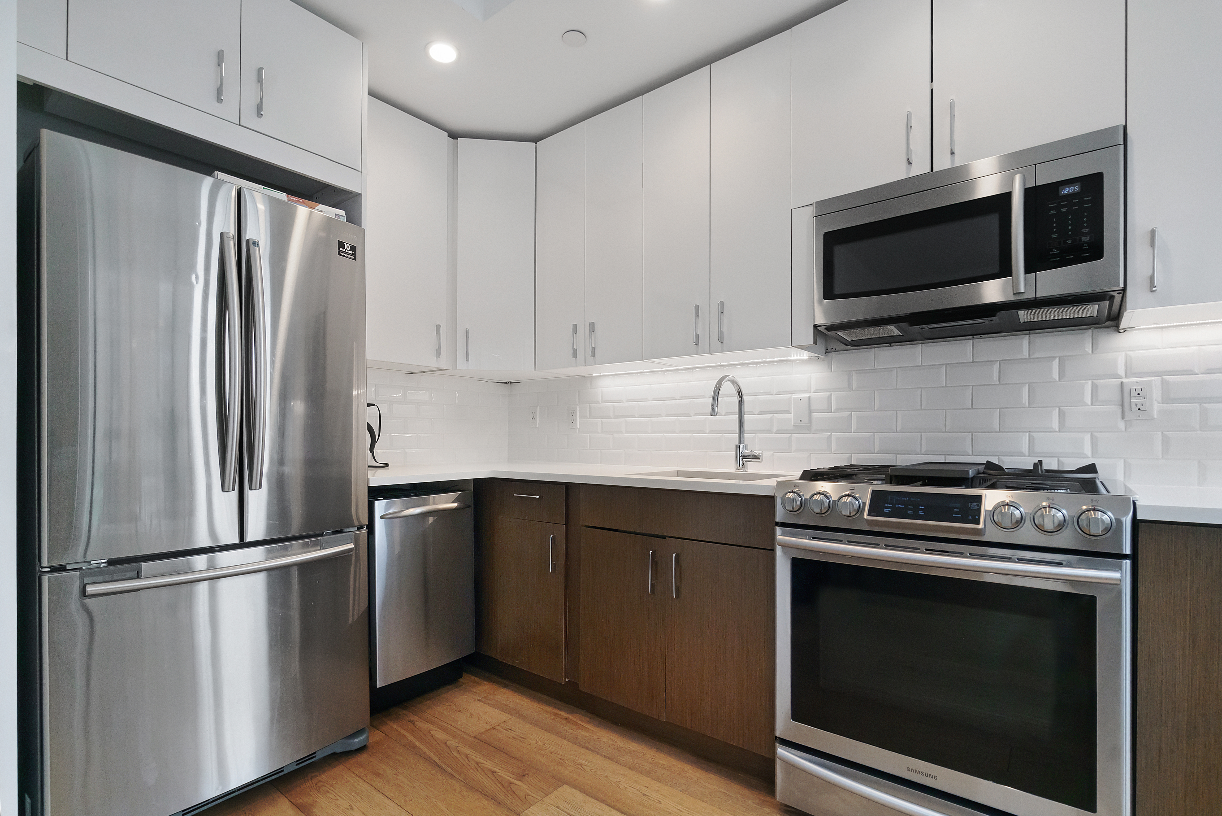 401 Rutland Road, Unit 2C Brooklyn, NY 11203 - Photo 3 of 13 a kitchen with a refrigerator stove and microwave