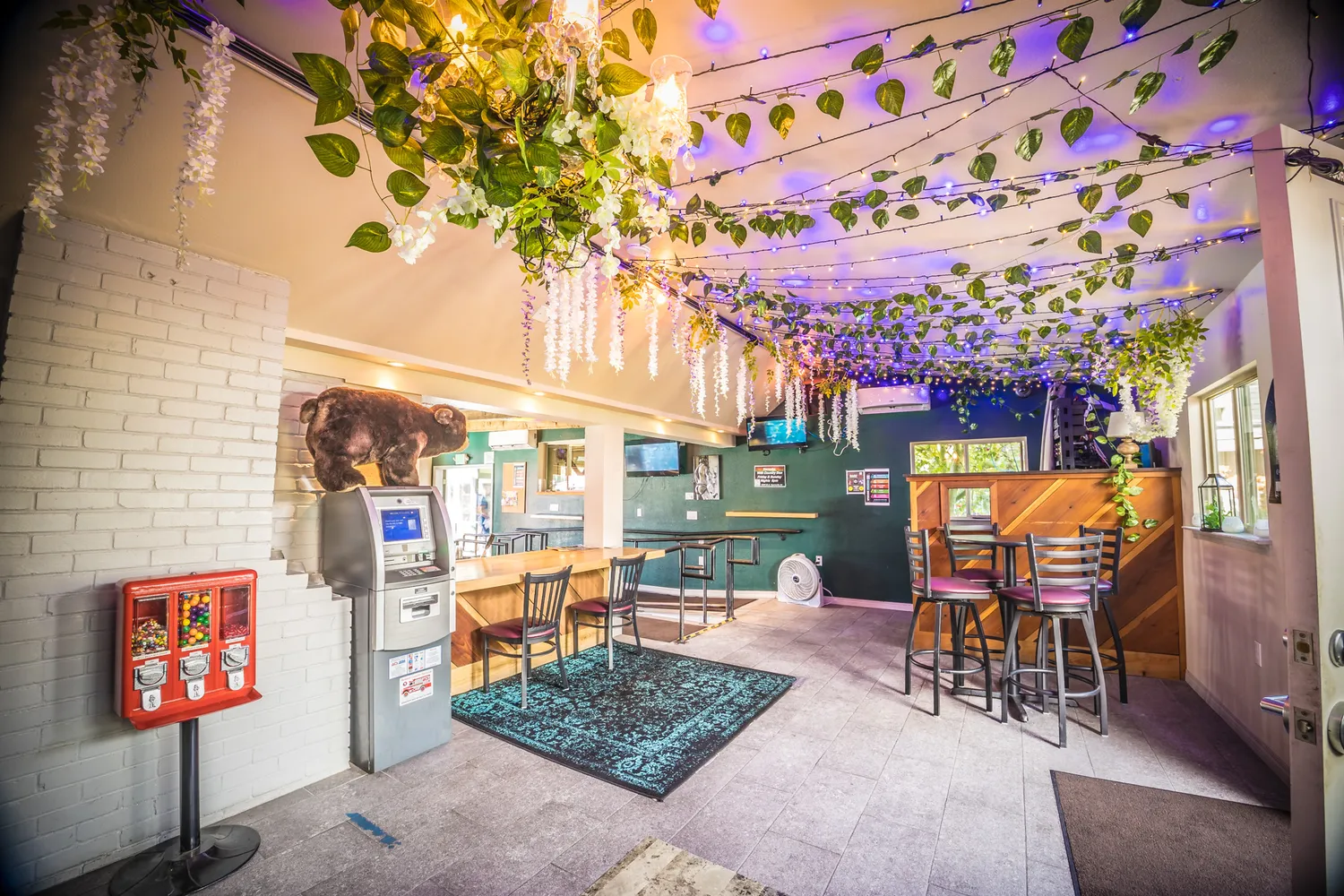 a view of a chairs and a table in the balcony