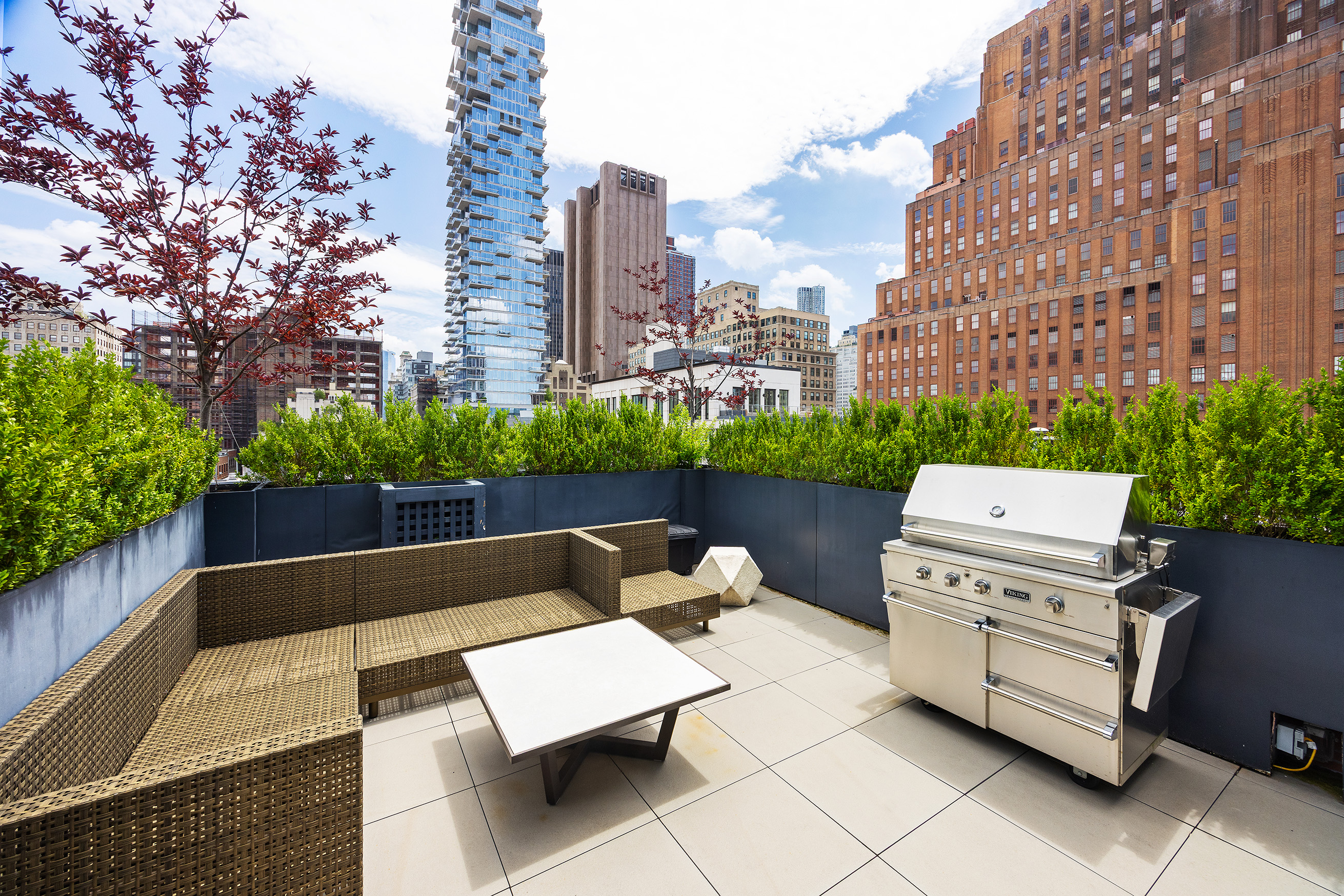 15 Leonard Street, Unit PH Manhattan, NY 10013 - Photo 18 of 37 a view of a patio with couches and a fire pit