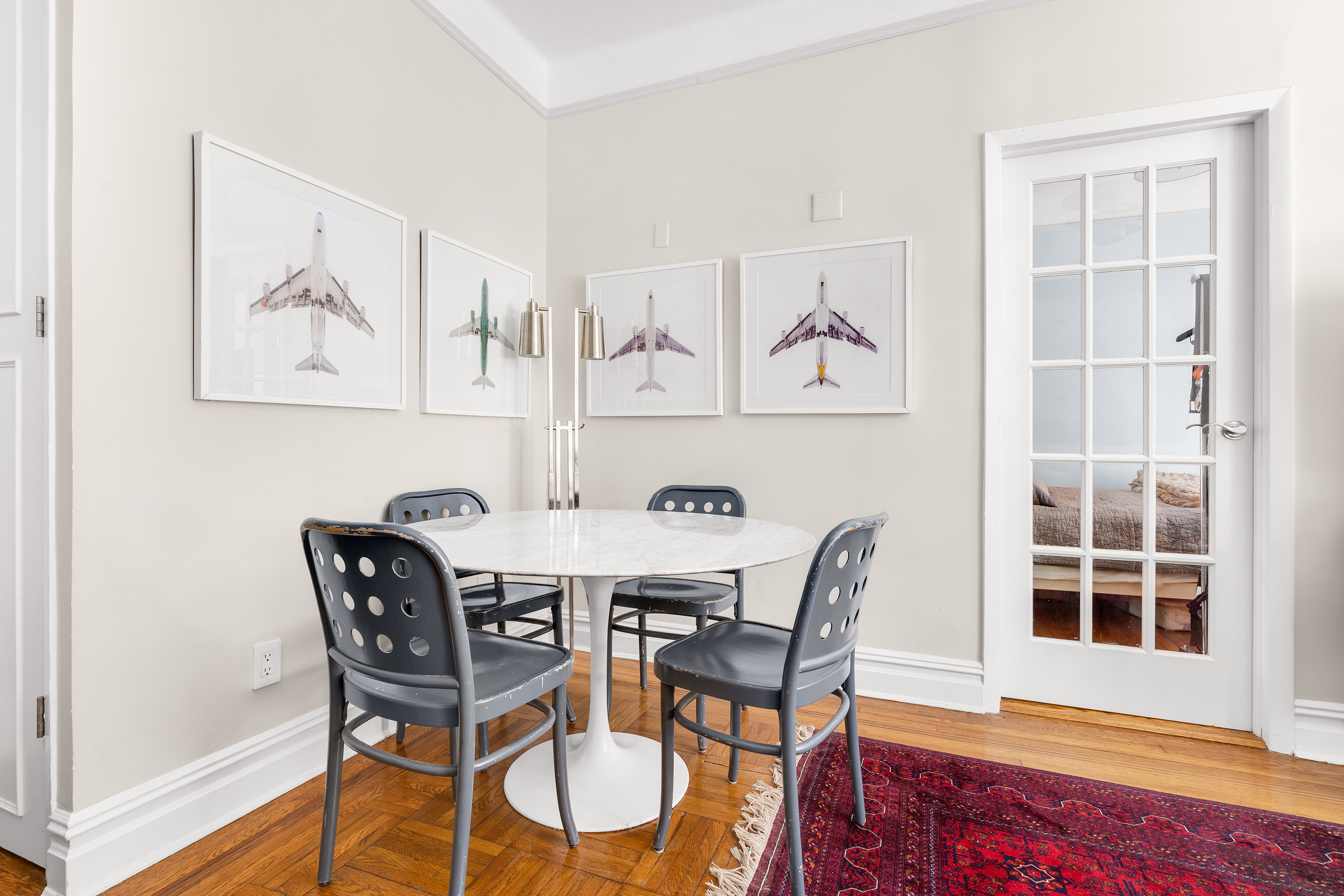 261 West 22nd Street, Unit 4 Manhattan, NY 10011 - Photo 2 of 8 a view of a dining room with furniture and wooden floor