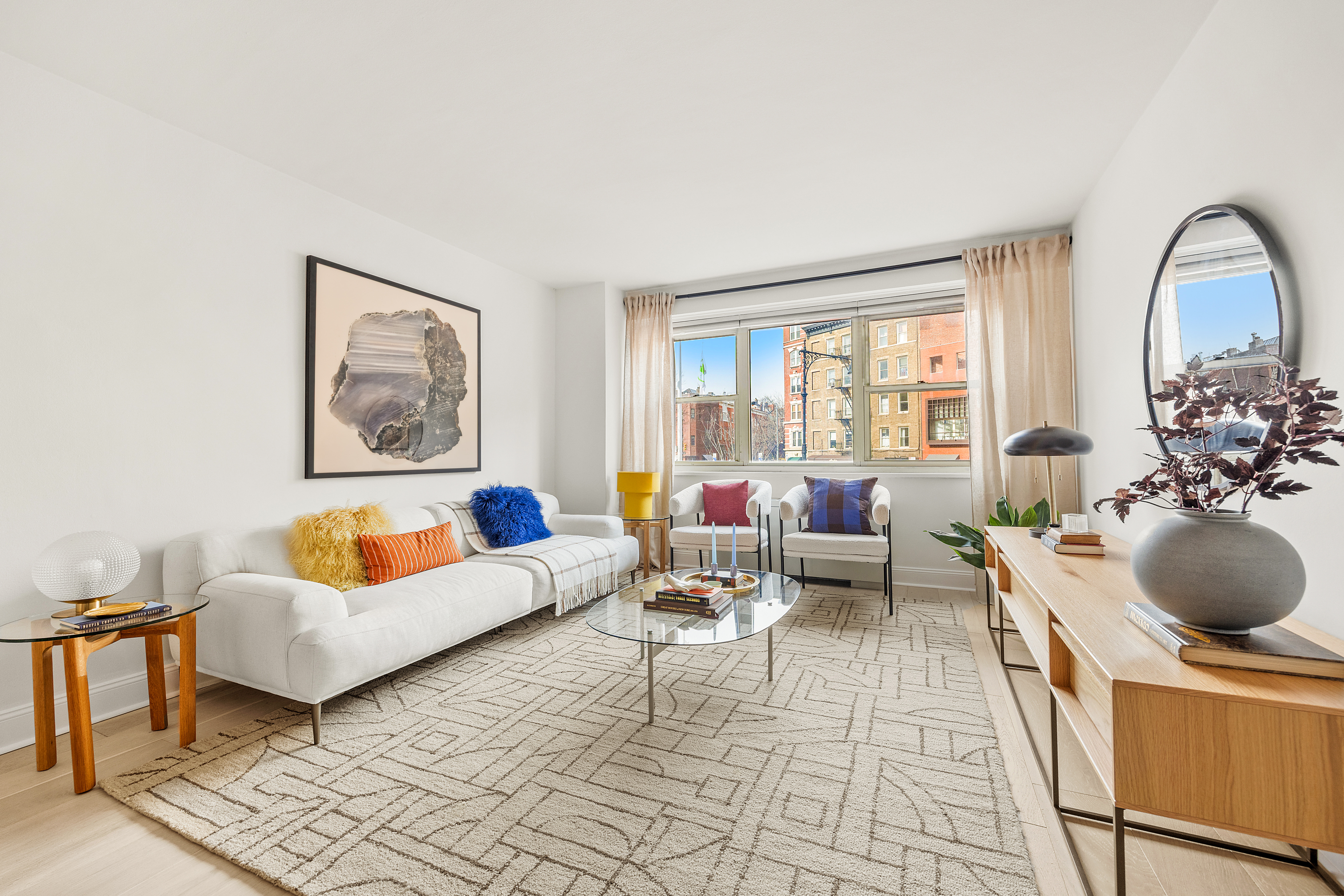 15 Charles Street, Unit 2H Manhattan, NY 10014 - Photo 2 of 12 a living room with furniture and a window