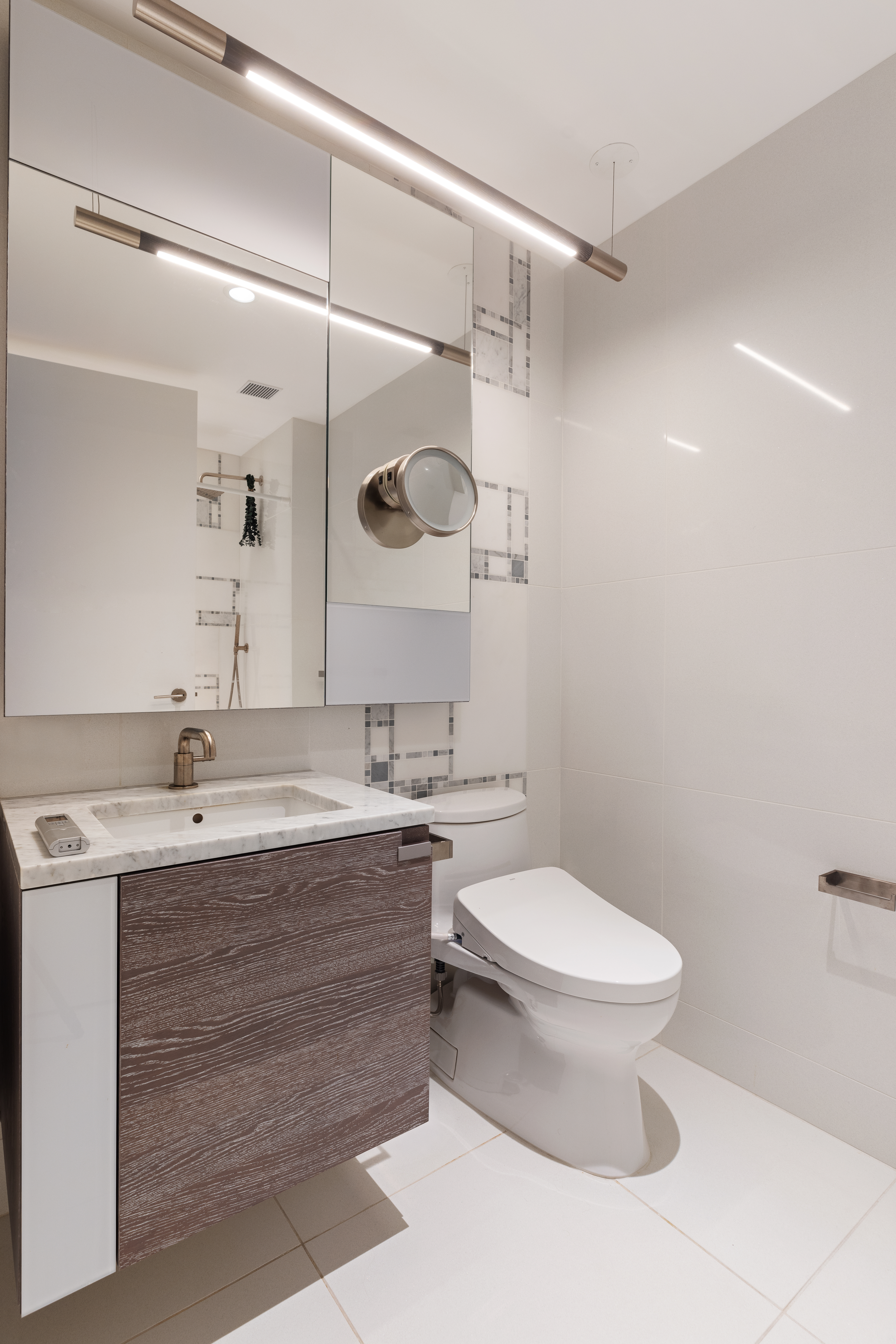 1 City Point, Unit 30D Brooklyn, NY 11201 - Photo 5 of 11 a bathroom with a double vanity sink toilet and shower
