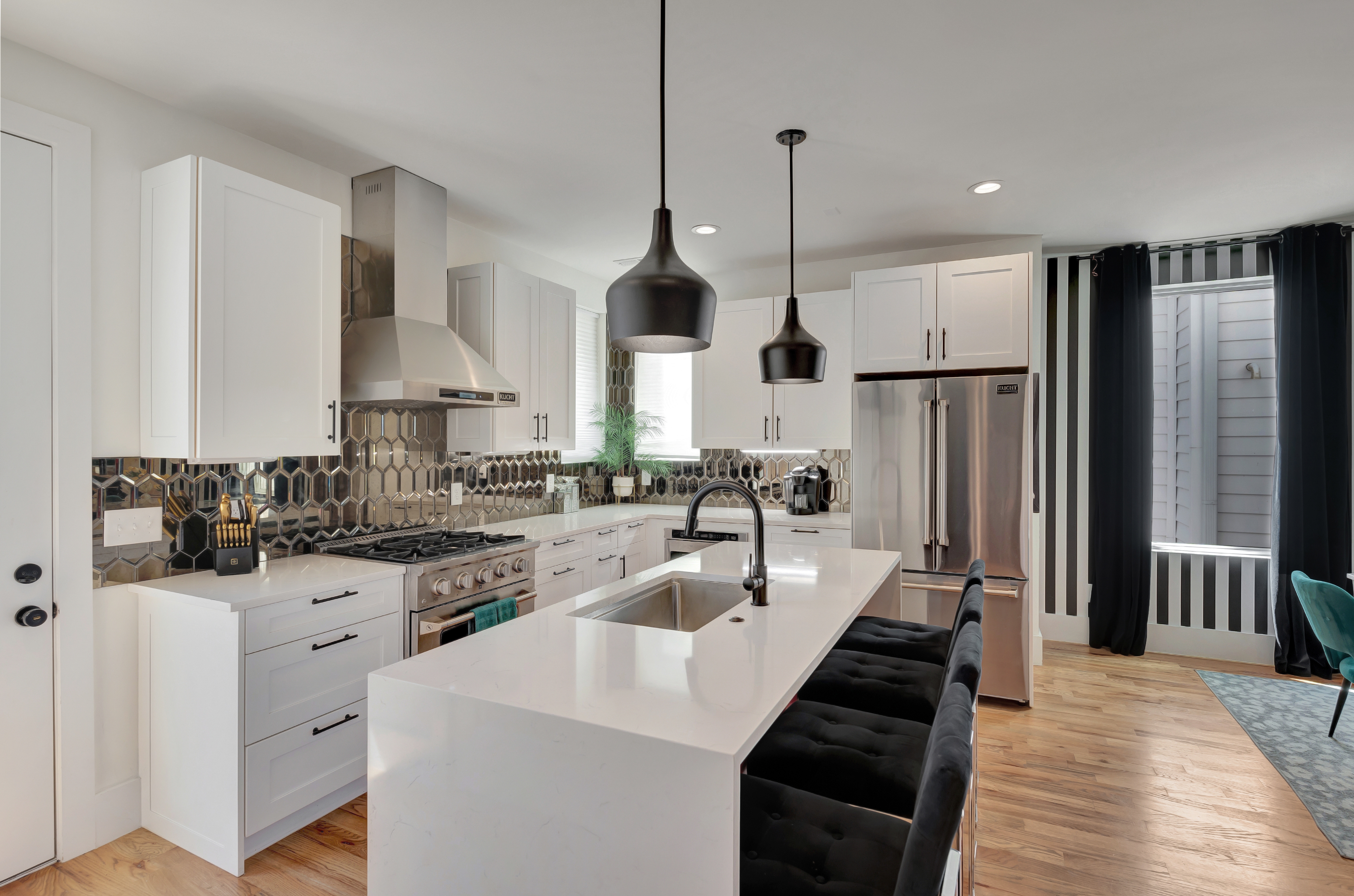 1203 Brick Church Pike Nashville, TN 37207 - Photo 10 of 44 a kitchen with stainless steel appliances kitchen island granite countertop a sink a stove a refrigerator and white cabinets with wooden floor