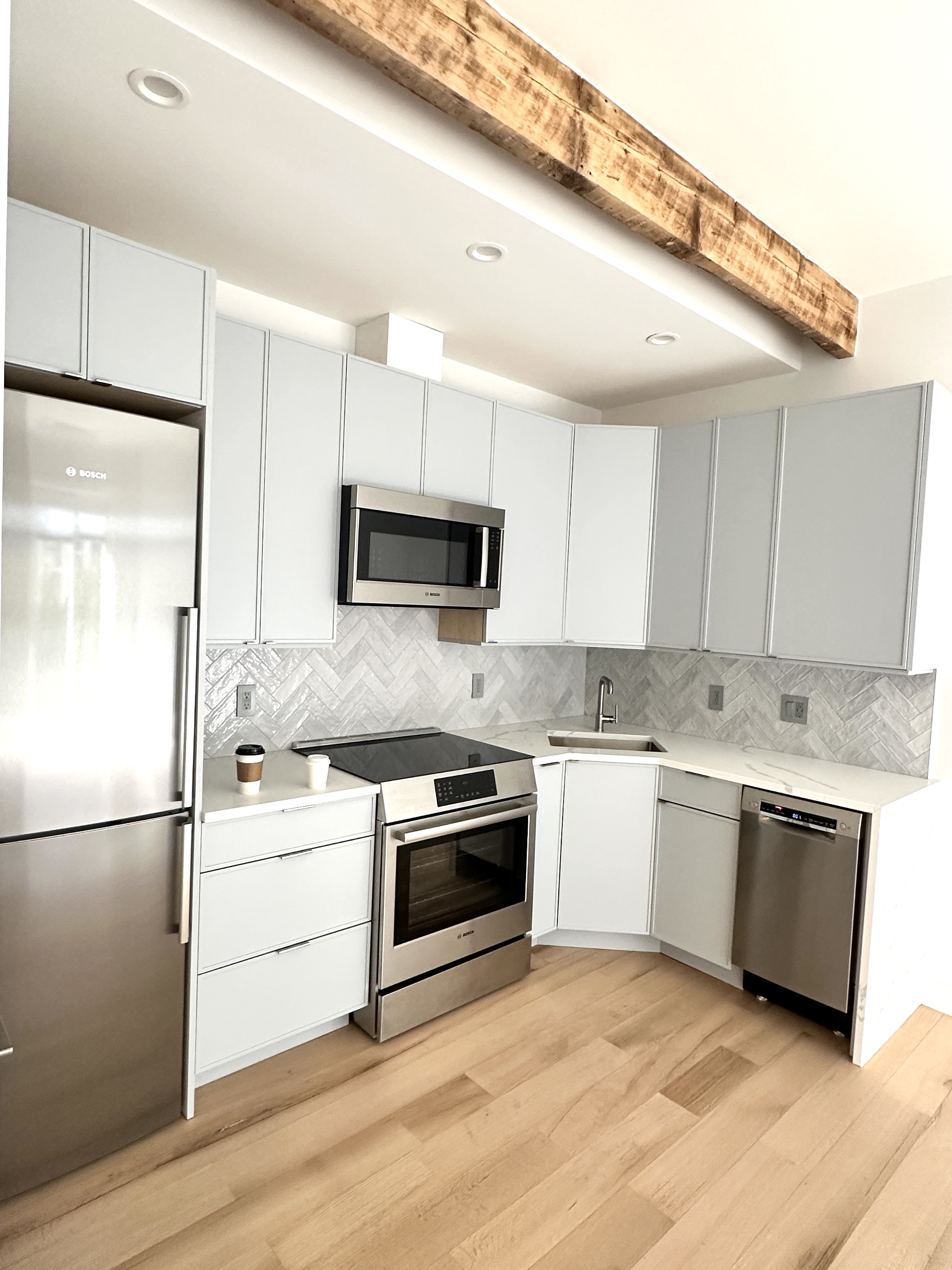 183 Java Street, Unit 1A Brooklyn, NY 11222 - Photo 2 of 12 a kitchen with a sink stove and refrigerator