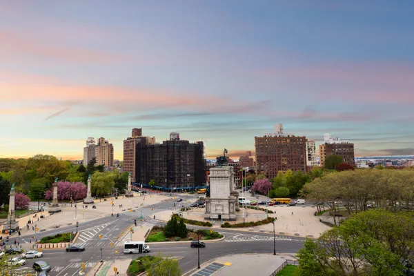 a view of a city with tall buildings in front of it