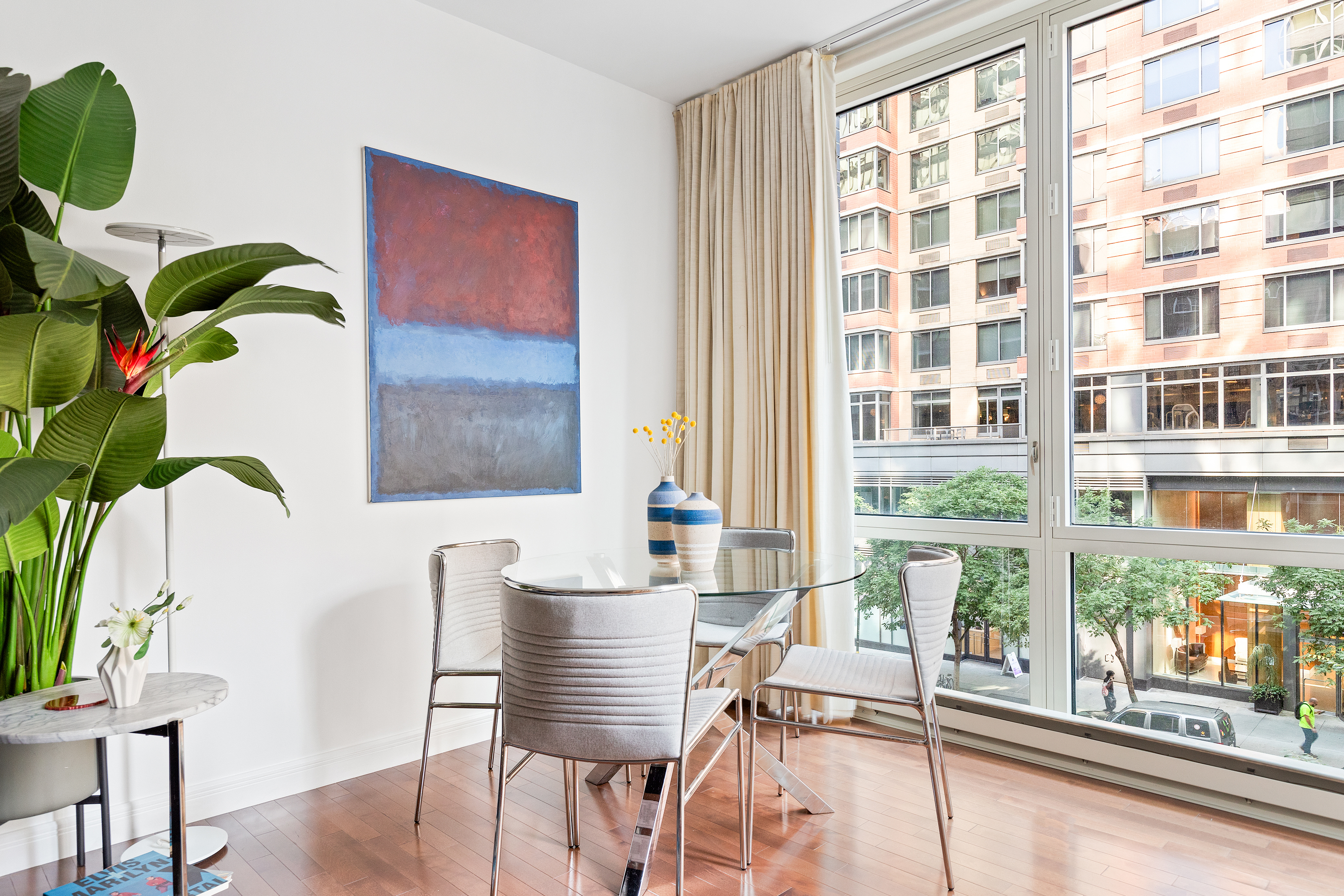 225 East 34th Street, Unit 3H Manhattan, NY 10016 - Photo 2 of 18 a living room with furniture and a floor to ceiling window