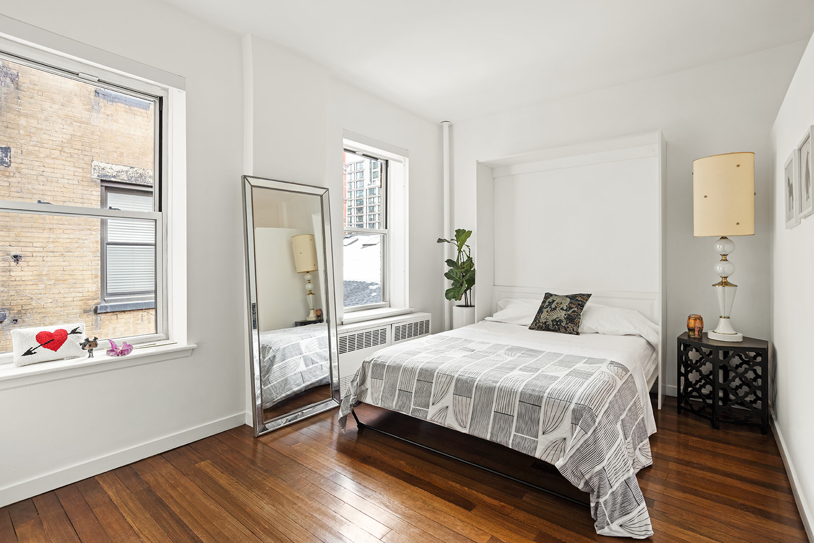 26 Gramercy Park South, Unit 5F Manhattan, NY 10003 - Photo 3 of 13 a bedroom with a bed and wooden floor