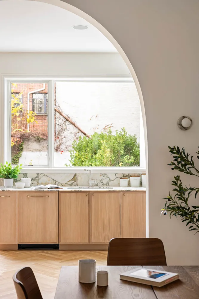 a kitchen with a stove top oven sink and cabinets
