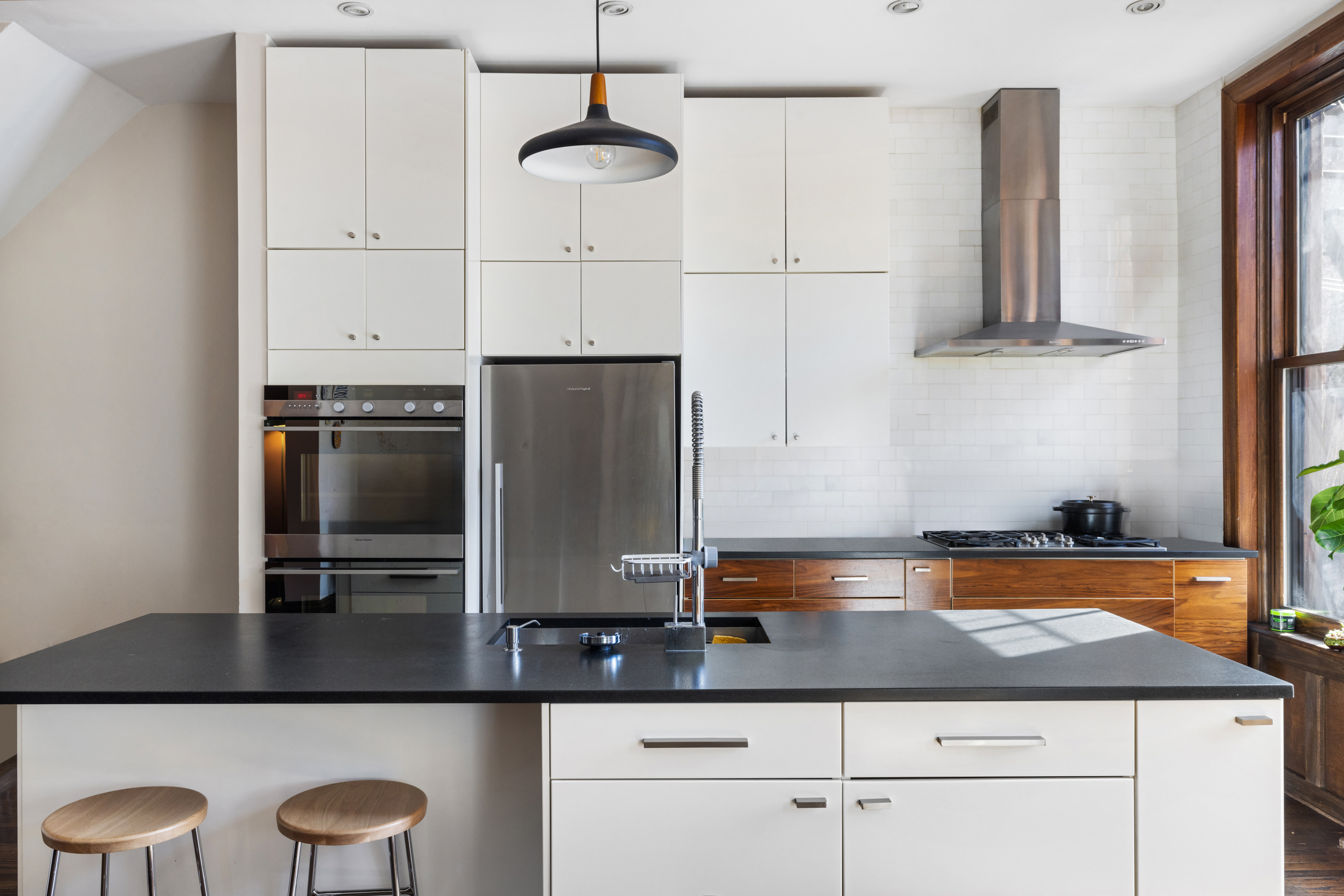 252 Stuyvesant Avenue Brooklyn, NY 11221 - Photo 2 of 26 a kitchen with stainless steel appliances granite countertop a sink a stove and refrigerator