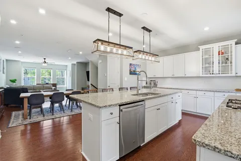 a kitchen with lots of counter space sink and appliances