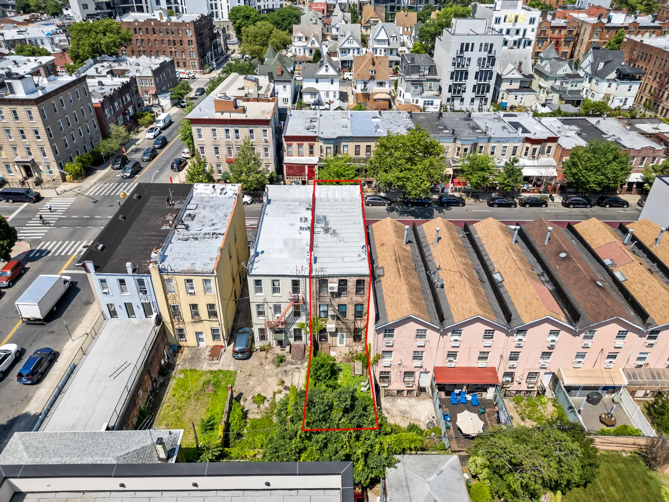 an aerial view of residential houses with outdoor space