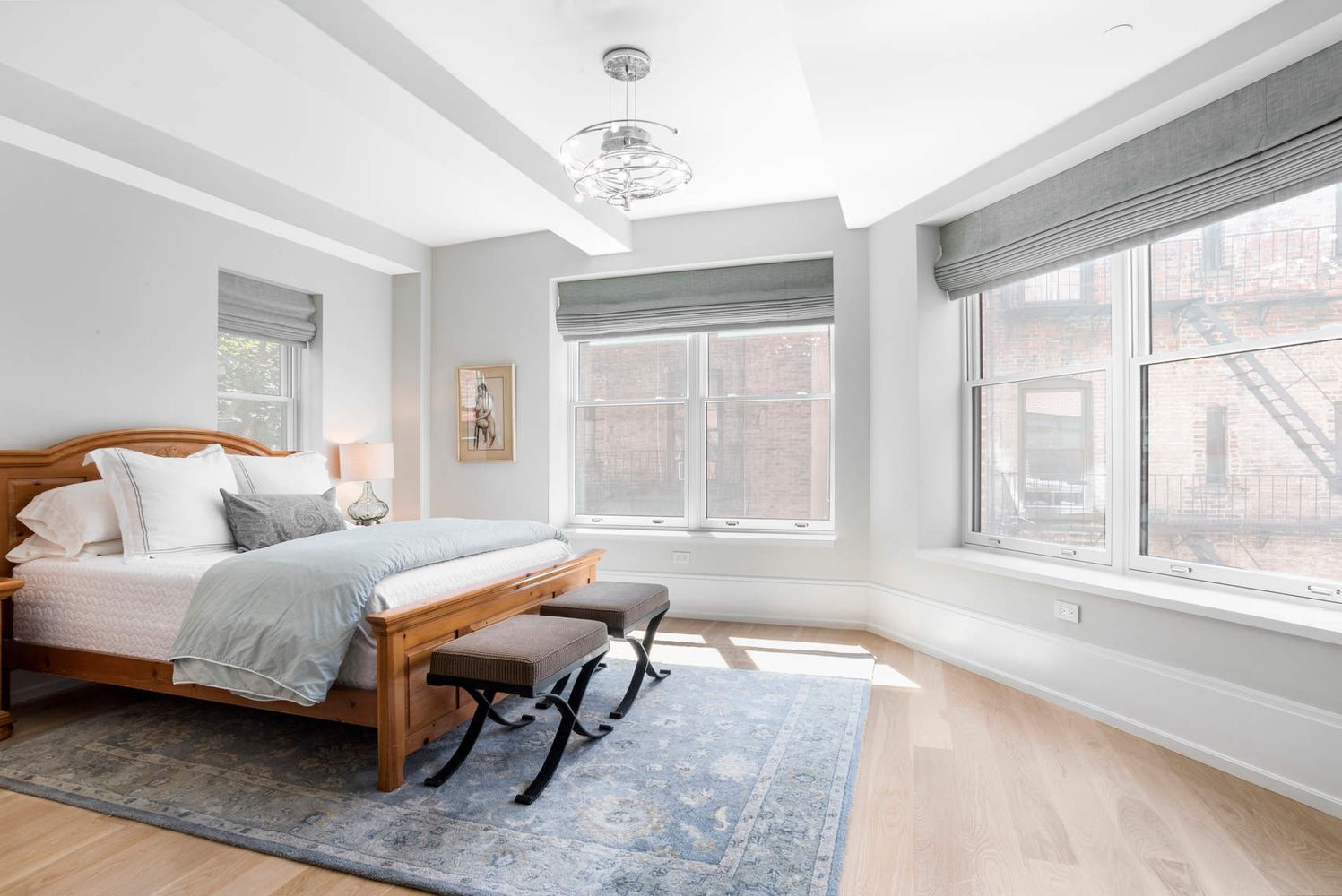 182 West 82nd Street, Unit 4E Manhattan, NY 10024 - Photo 11 of 25 a spacious bedroom with a bed and a large window