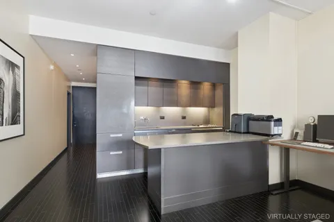 a kitchen with stainless steel appliances a sink and cabinets