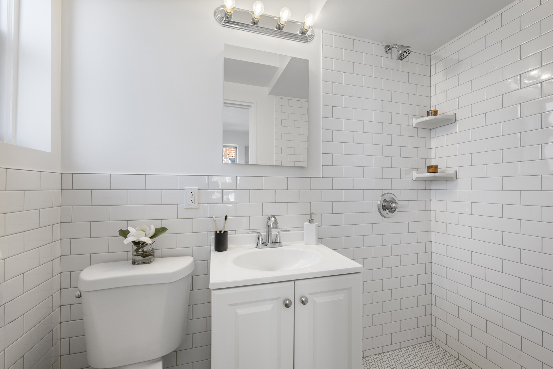 3850 Hudson Manor Terrace, Unit 6DW Bronx, NY 10463 - Photo 6 of 9 a bathroom with a sink a toilet and shower