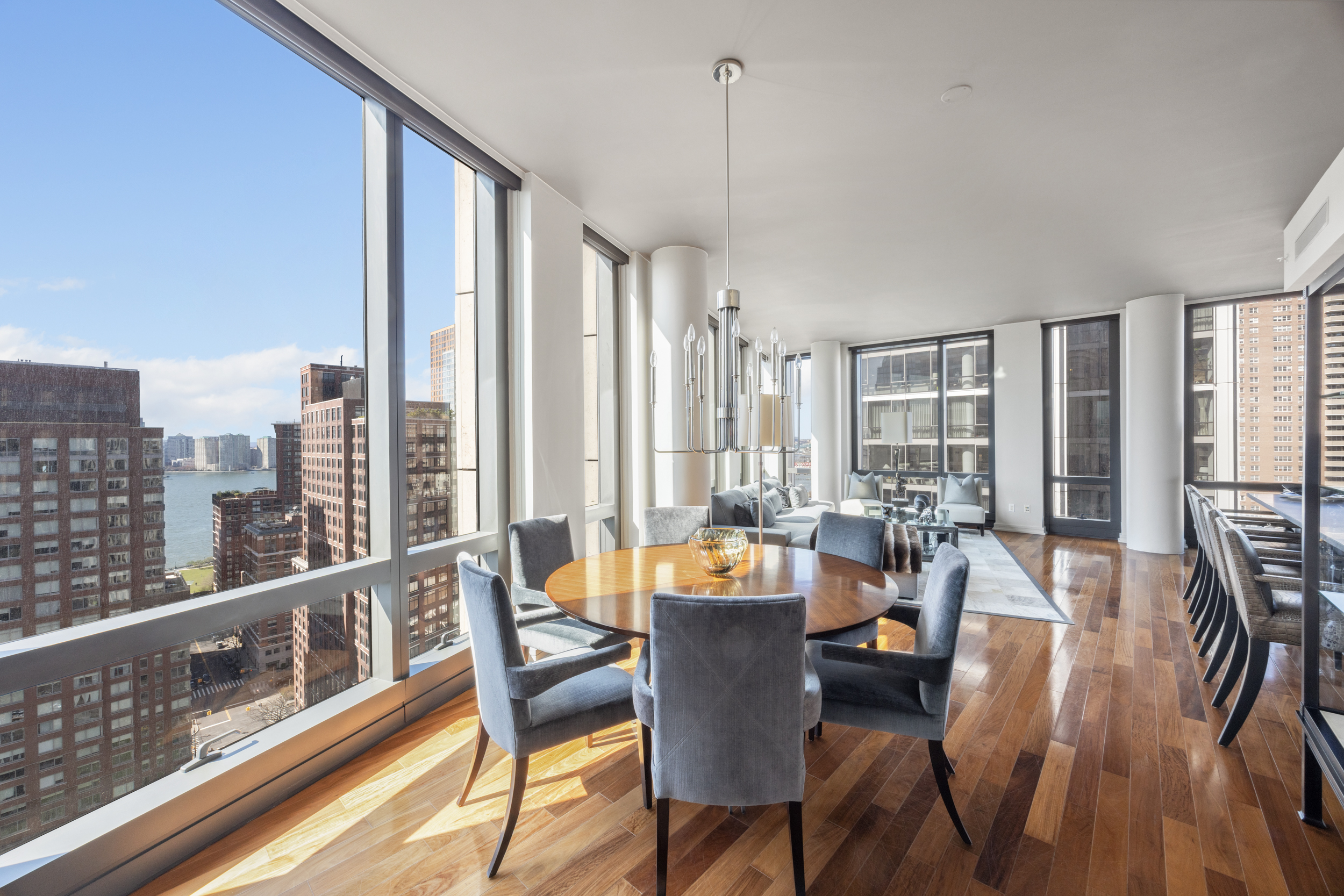 101 Warren Street, Unit 2220 Manhattan, NY 10007 - Photo 2 of 19 a view of a dining room with furniture window and wooden floor