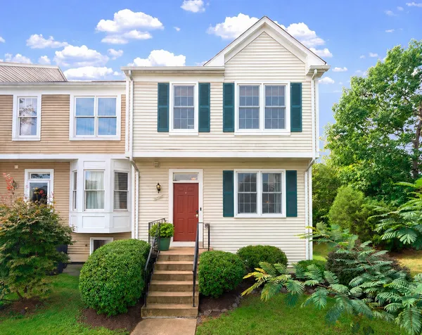 a front view of a house with garden