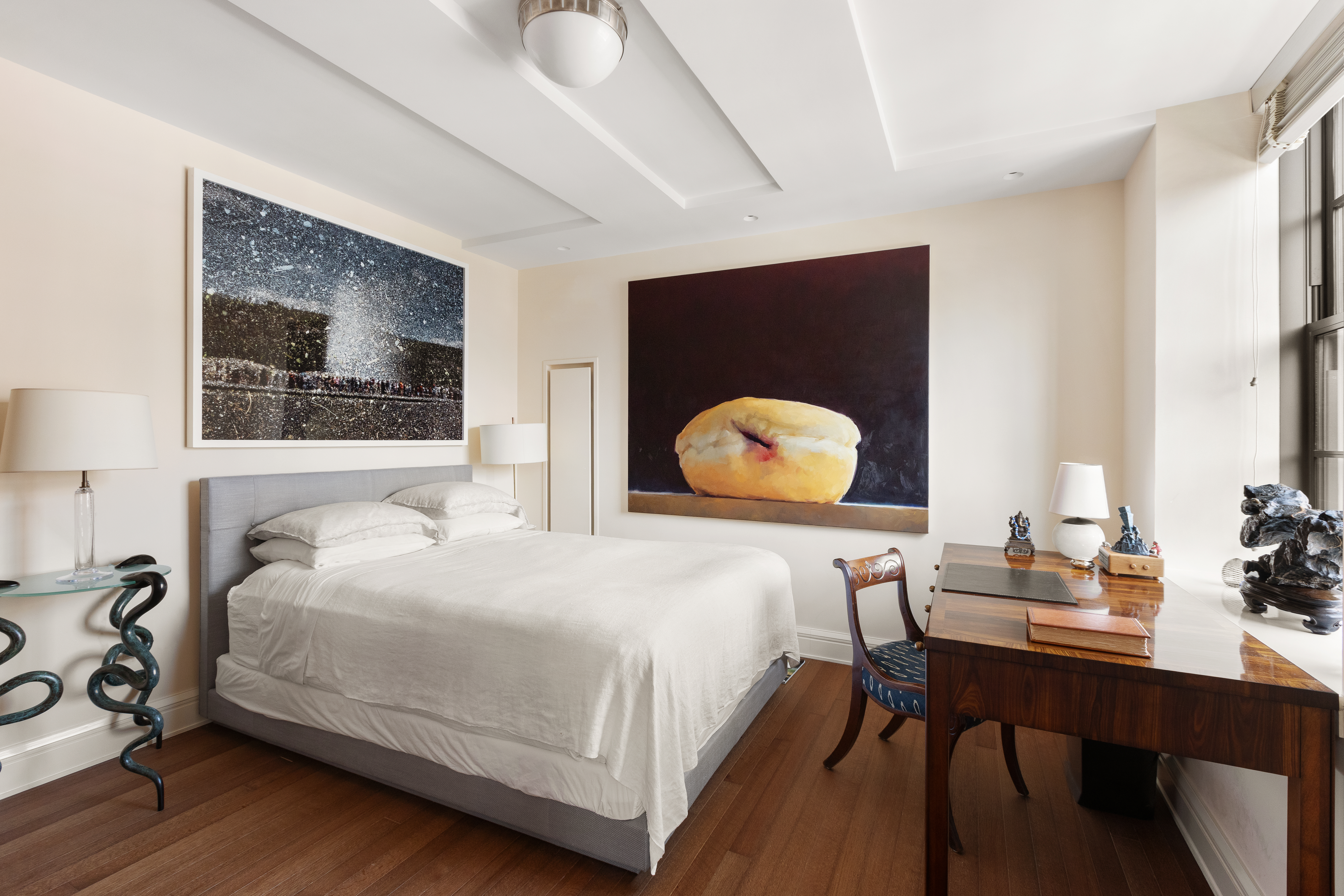 160 West 12th Street, Unit 104 Manhattan, NY 10011 - Photo 12 of 28 a bedroom with a bed and a table