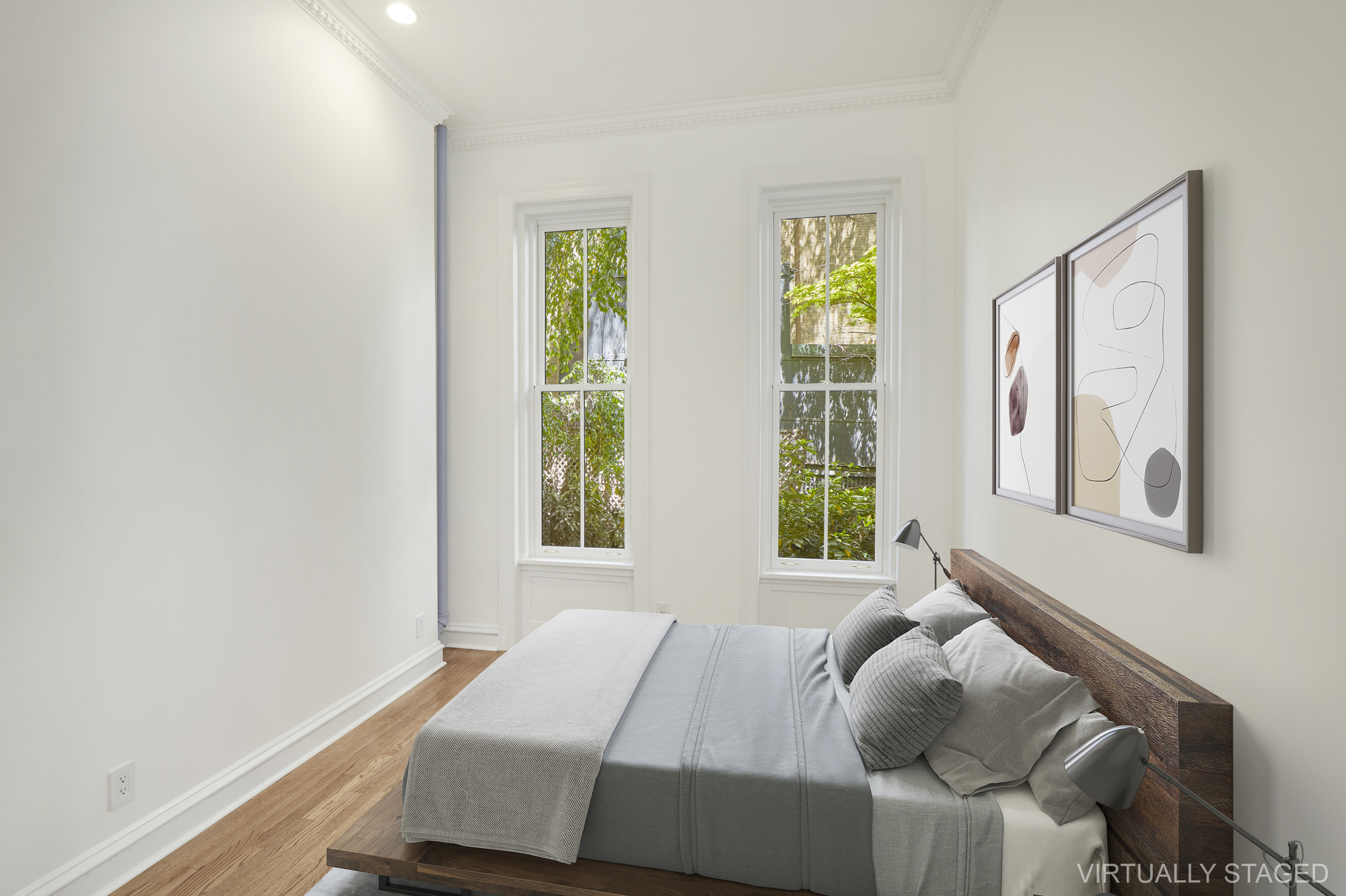 157 East 75th Street, Unit 1E Manhattan, NY 10021 - Photo 6 of 21 a bed sitting in a bedroom next to a window