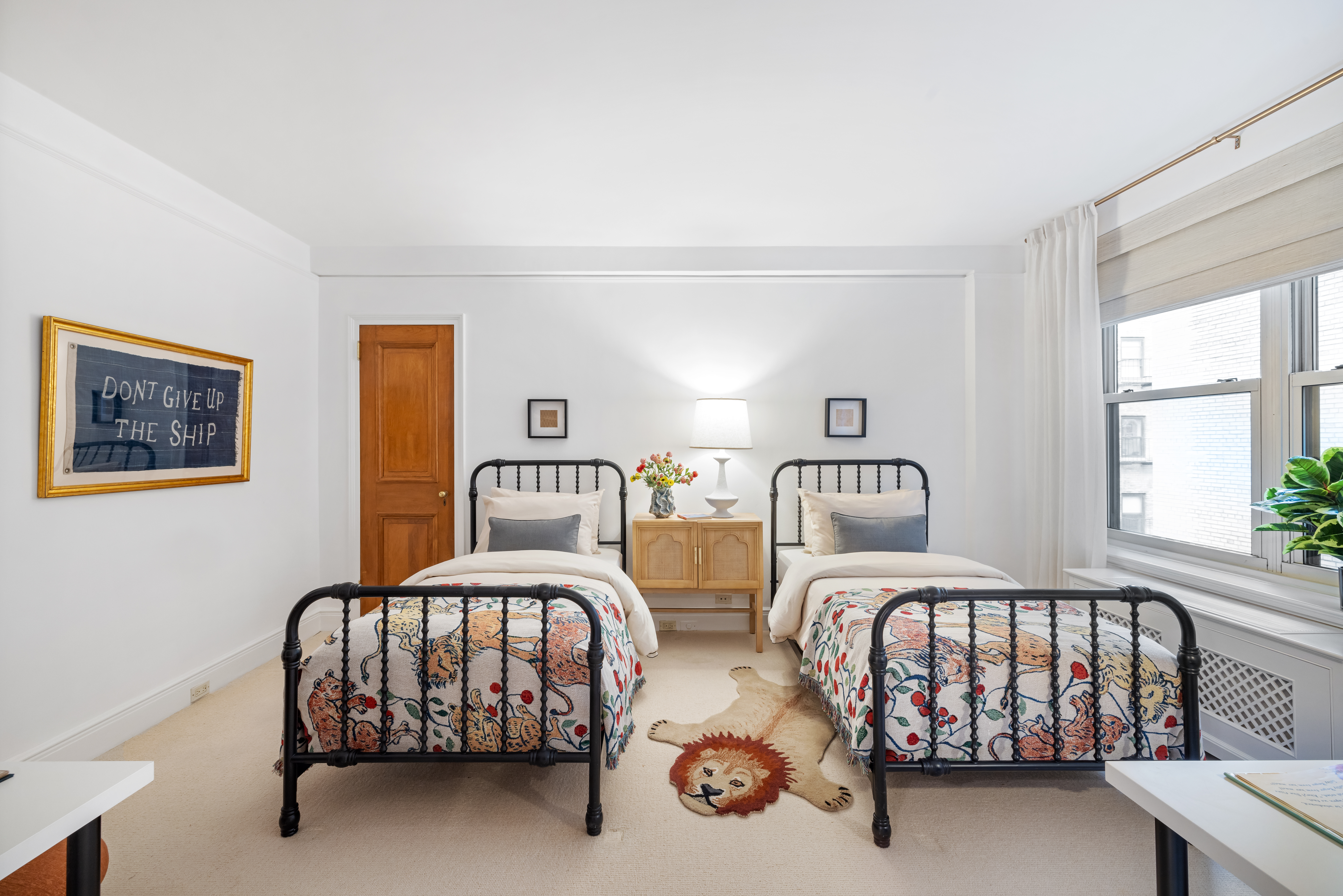 320 East 72nd Street, Unit 5B Manhattan, NY 10021 - Photo 13 of 18 a bedroom with two beds and a window