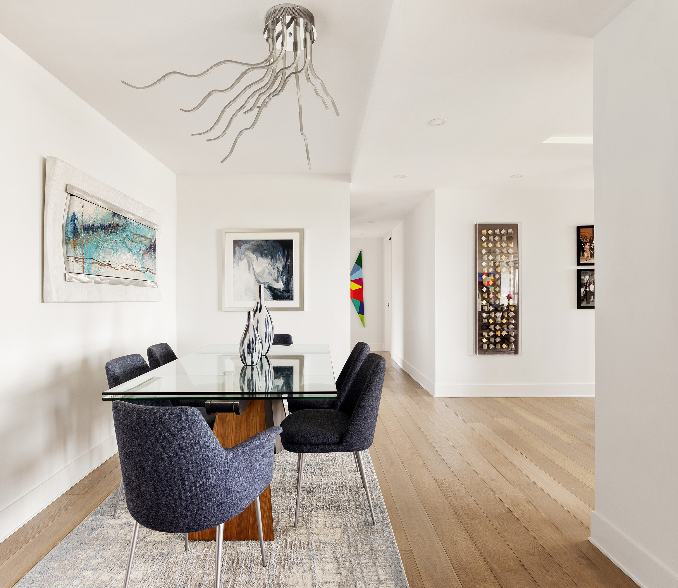 535 East 86th Street, Unit 16F Manhattan, NY 10028 - Photo 7 of 19 a view of a dining room with furniture wooden floor and a chandelier