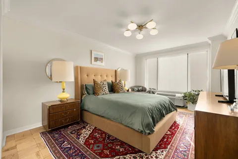 a bedroom with a bed and a television