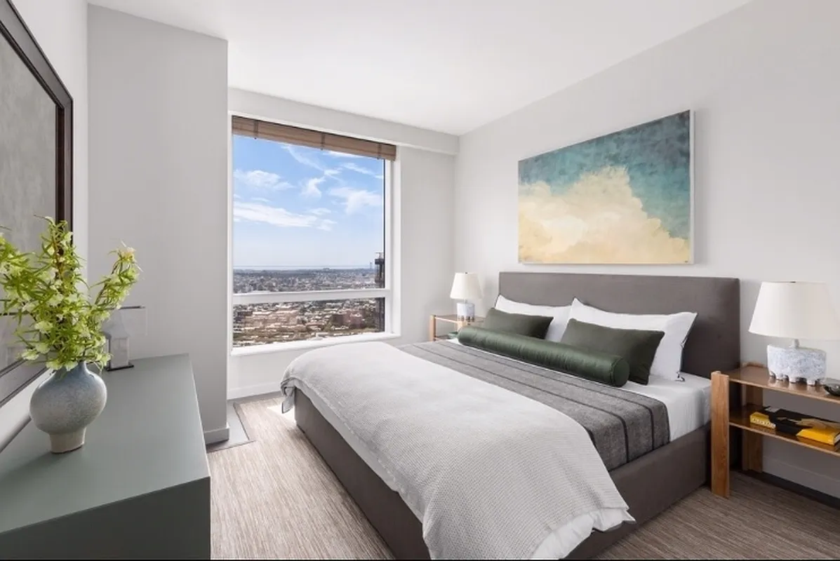 1 City Point, Unit 25L Brooklyn, NY 11201 - Photo 4 of 25 a bedroom with a large bed and a potted plant