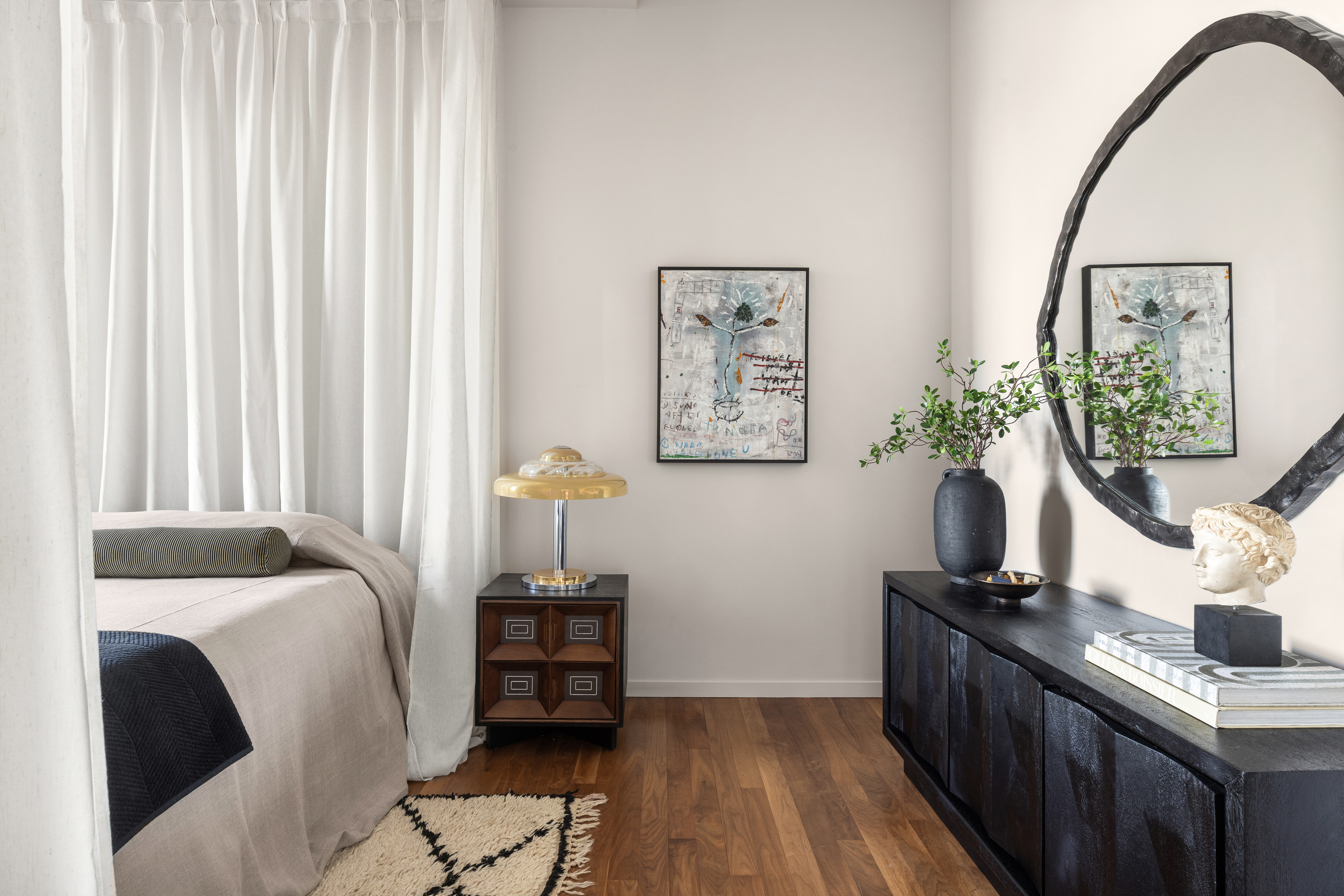 175 East Broadway, Unit 7A Manhattan, NY 10002 - Photo 15 of 24 a bedroom with a bed and a potted plant