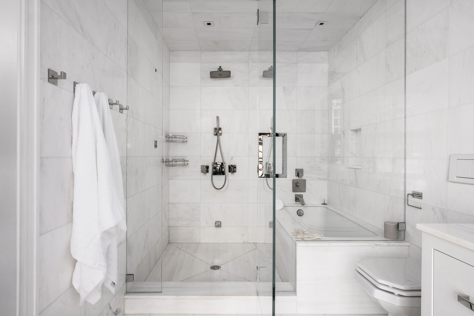 137 Franklin Street, Unit 1 Manhattan, NY 10013 - Photo 13 of 25 a bathroom with a shower and a toilet