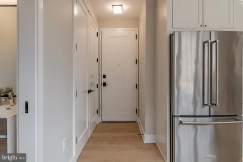 a view of a kitchen with a white door