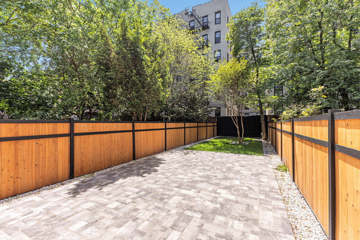 1050 Sterling Place Brooklyn, NY 11213 - Photo 15 of 23 a view of backyard with wooden fence