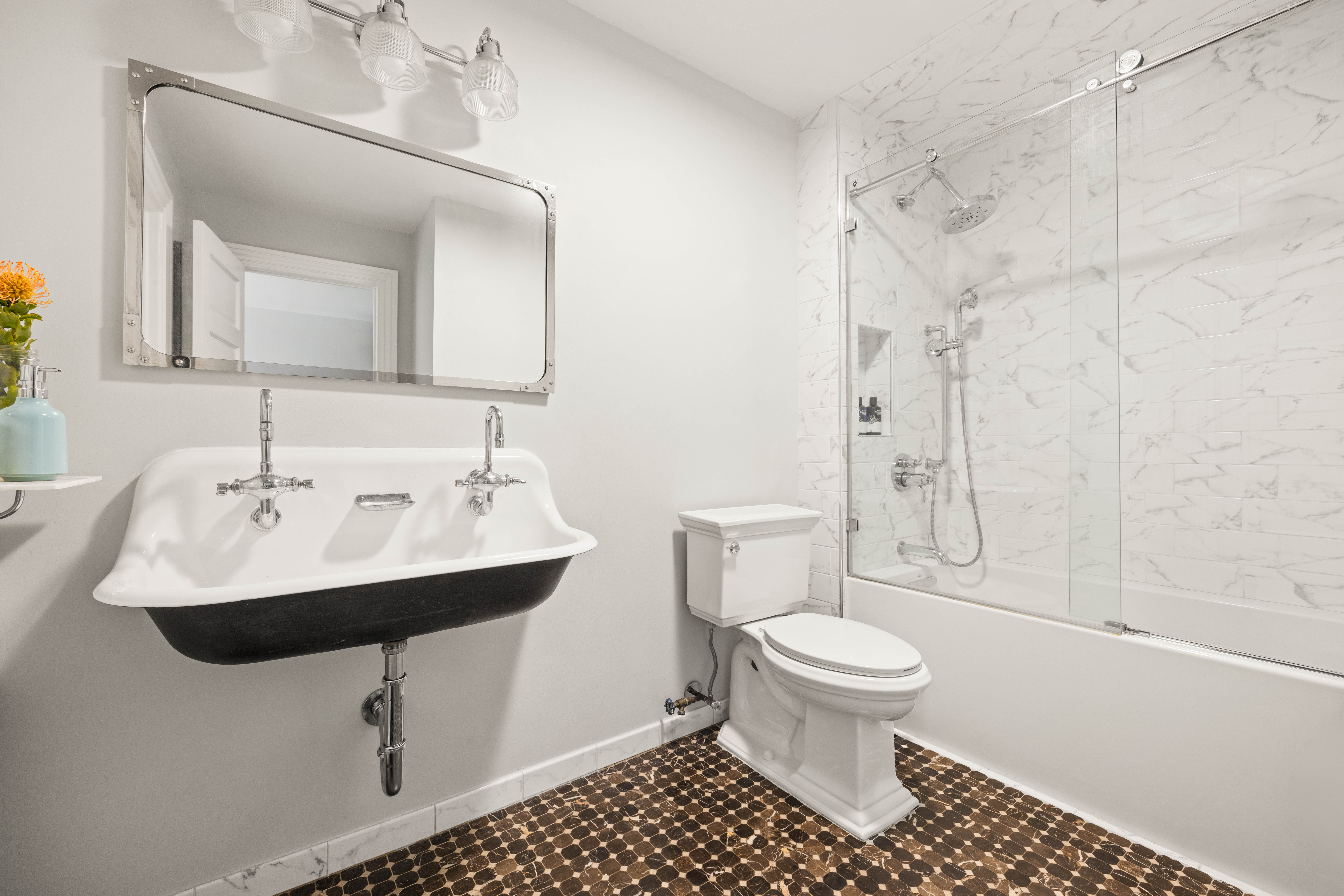 38 7th Avenue, Unit 1 Brooklyn, NY 11217 - Photo 5 of 13 a bathroom with a sink toilet and shower