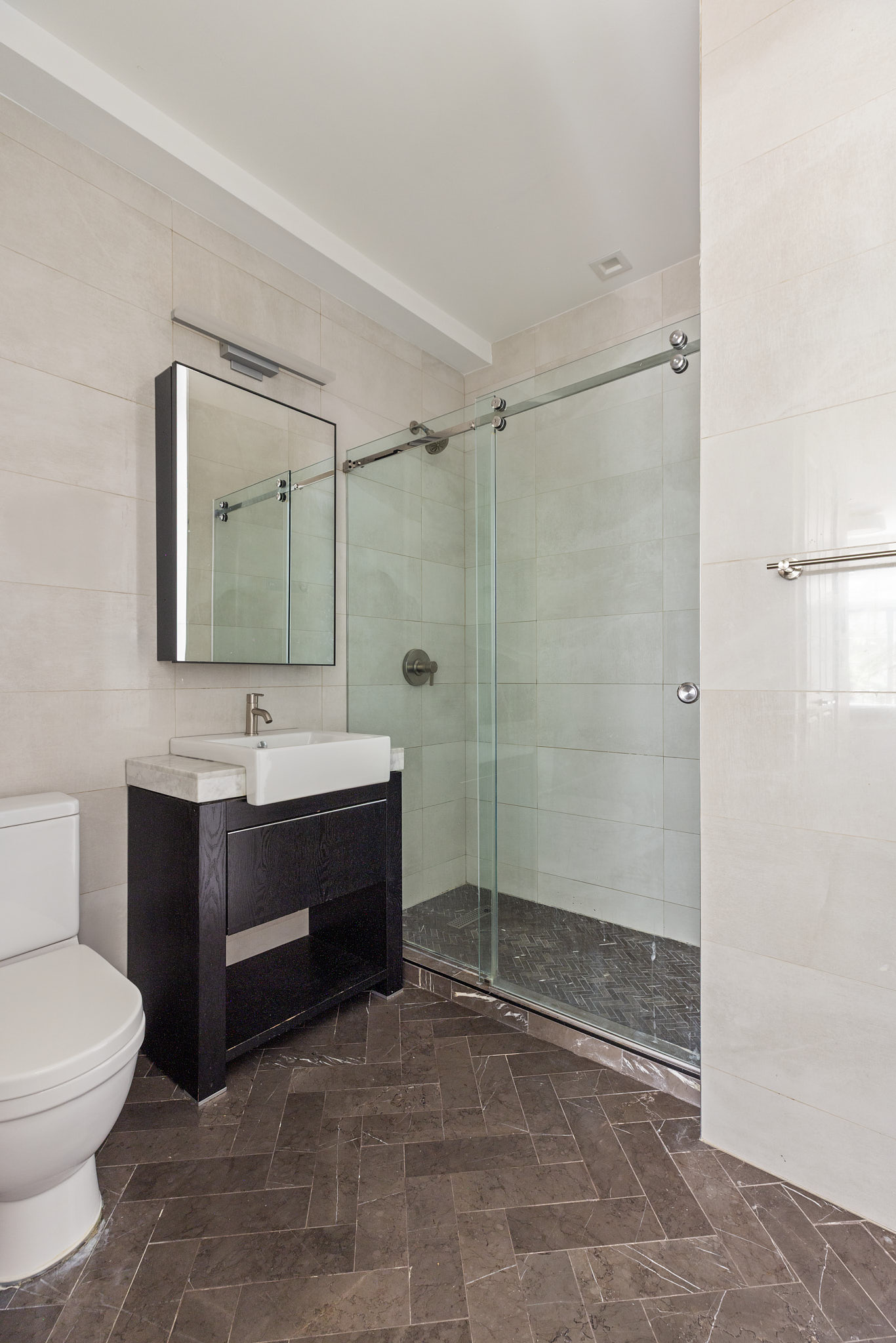 578 Sterling Place, Unit 2 Brooklyn, NY 11238 - Photo 6 of 10 a bathroom with a sink a toilet and shower