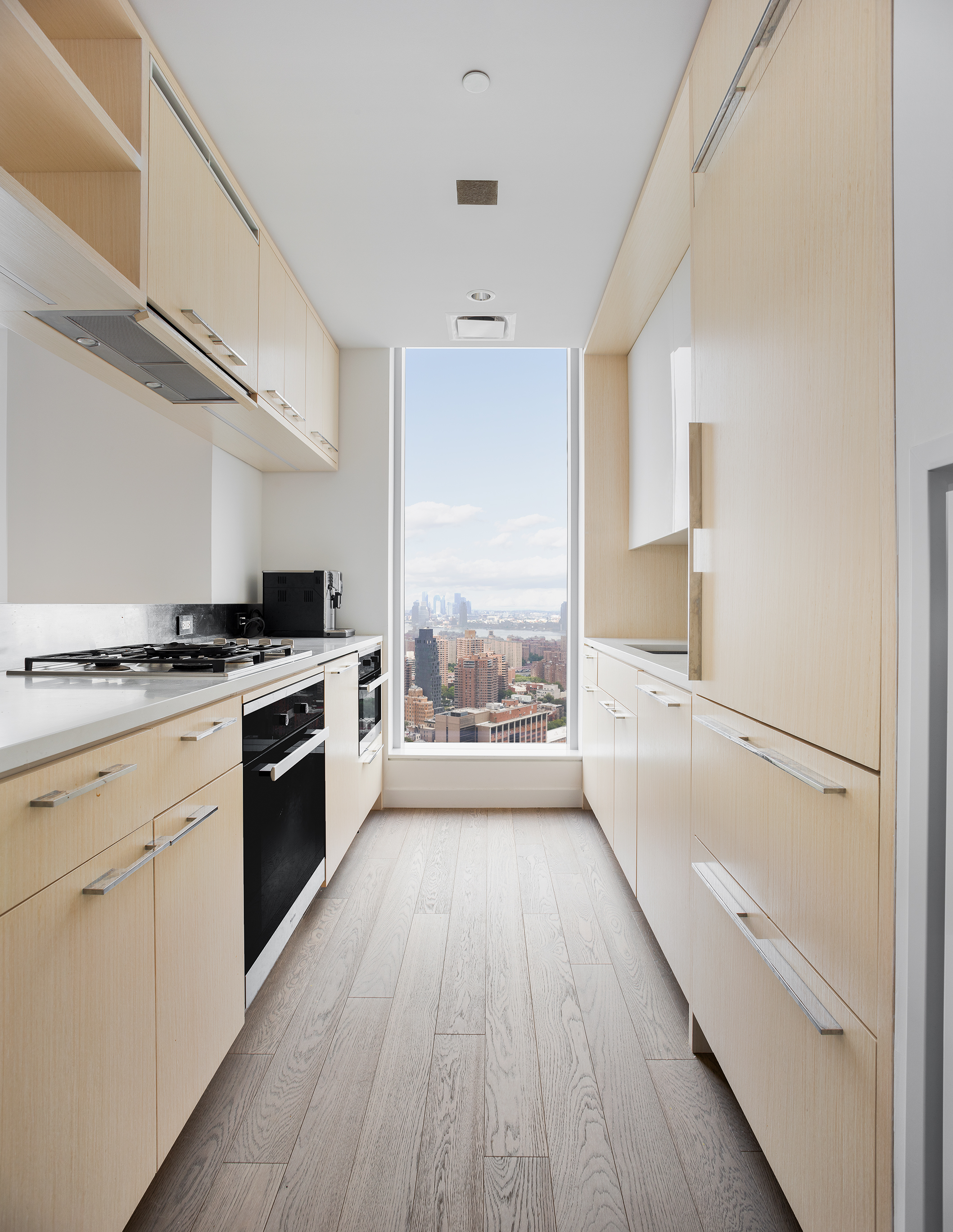 252 South Street, Unit 42K Manhattan, NY 10002 - Photo 3 of 6 a view of a kitchen with a stove top oven