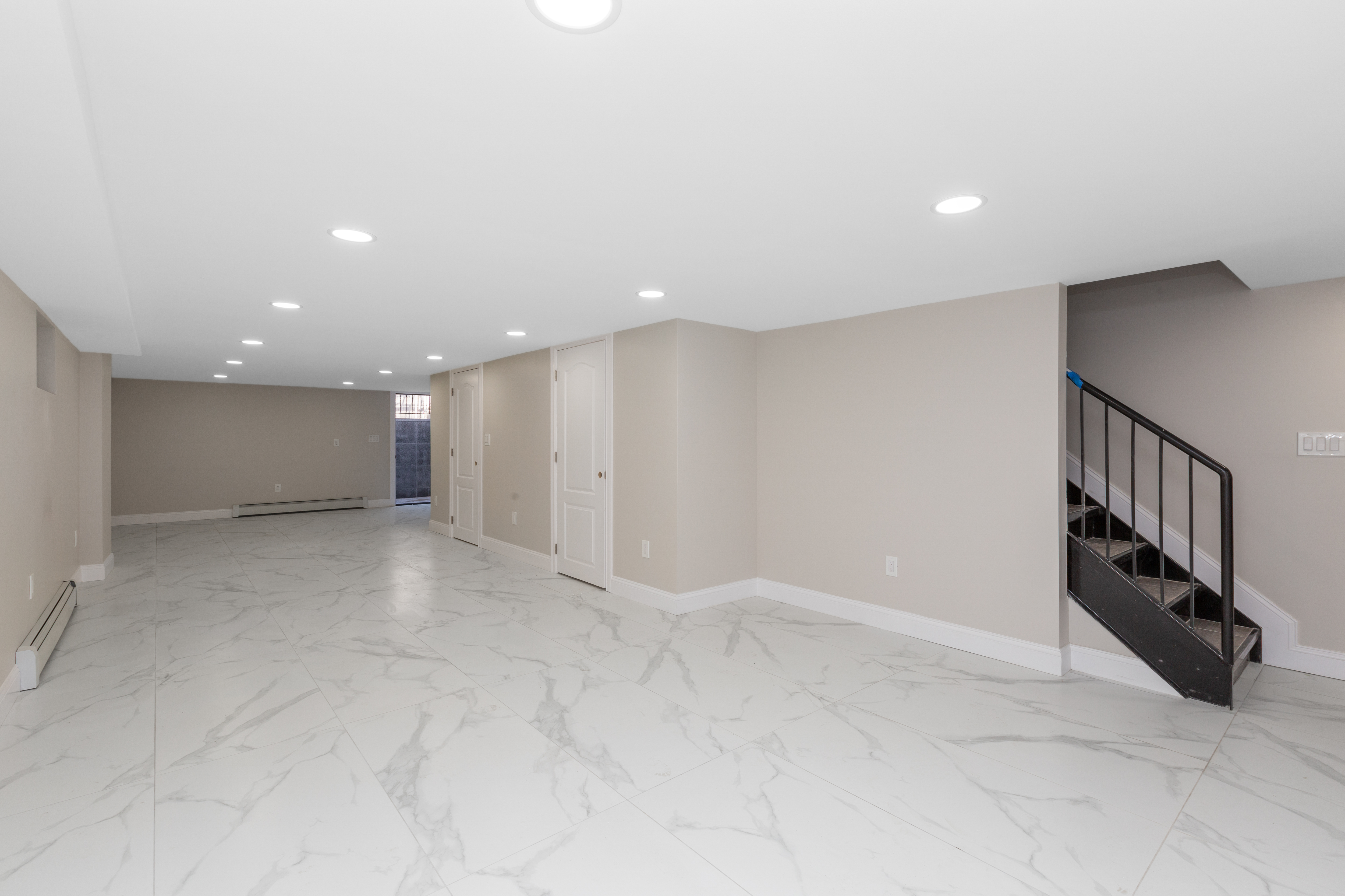 143-10 Shore Avenue Queens, NY 11435 - Photo 21 of 30 a view of an empty room with stairs