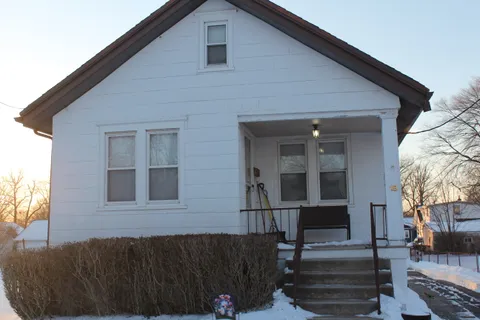 a view of a house with wooden floor and a potted plant