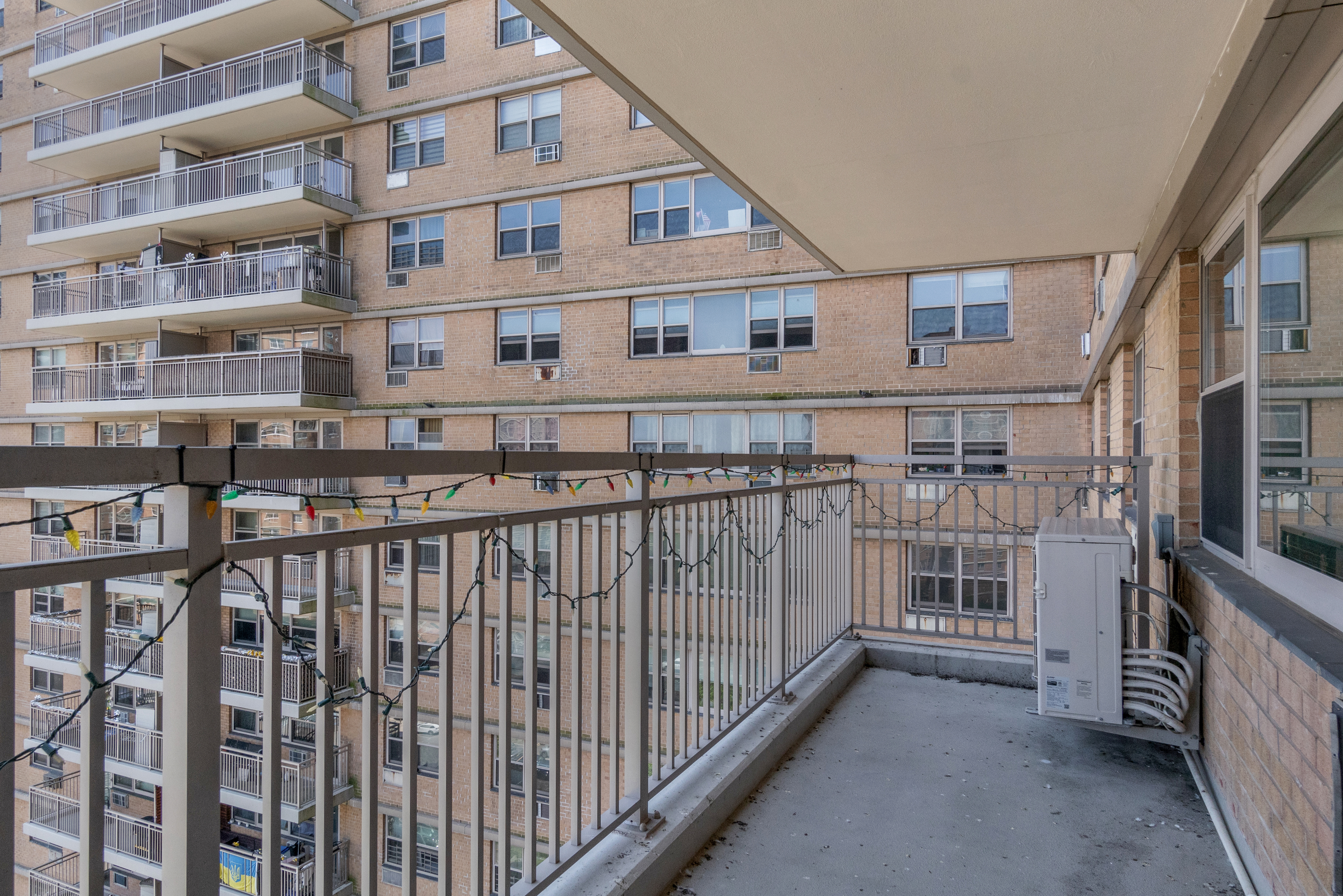 448 Neptune Avenue, Unit 14L Brooklyn, NY 11224 - Photo 13 of 20 a view of a building from a balcony