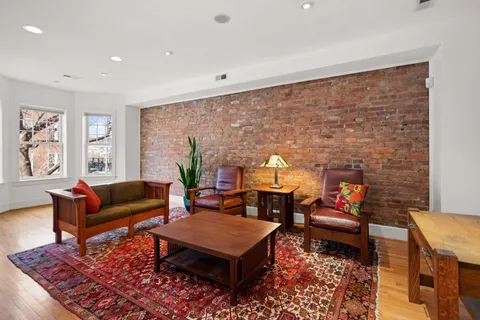 a living room with furniture and a rug