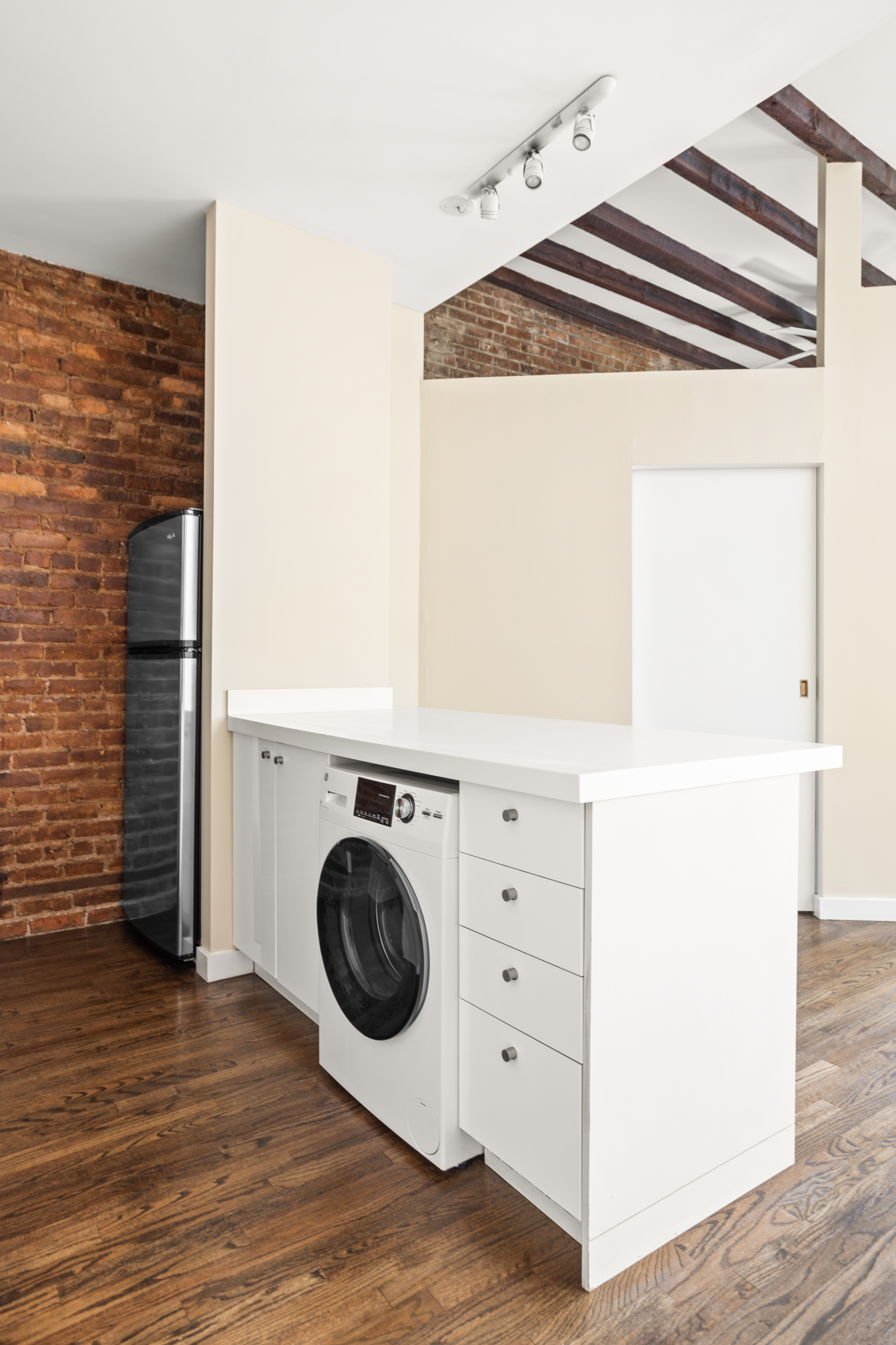 22 East 13th Street, Unit 2R Manhattan, NY 10003 - Photo 4 of 8 a utility room with dryer and washer