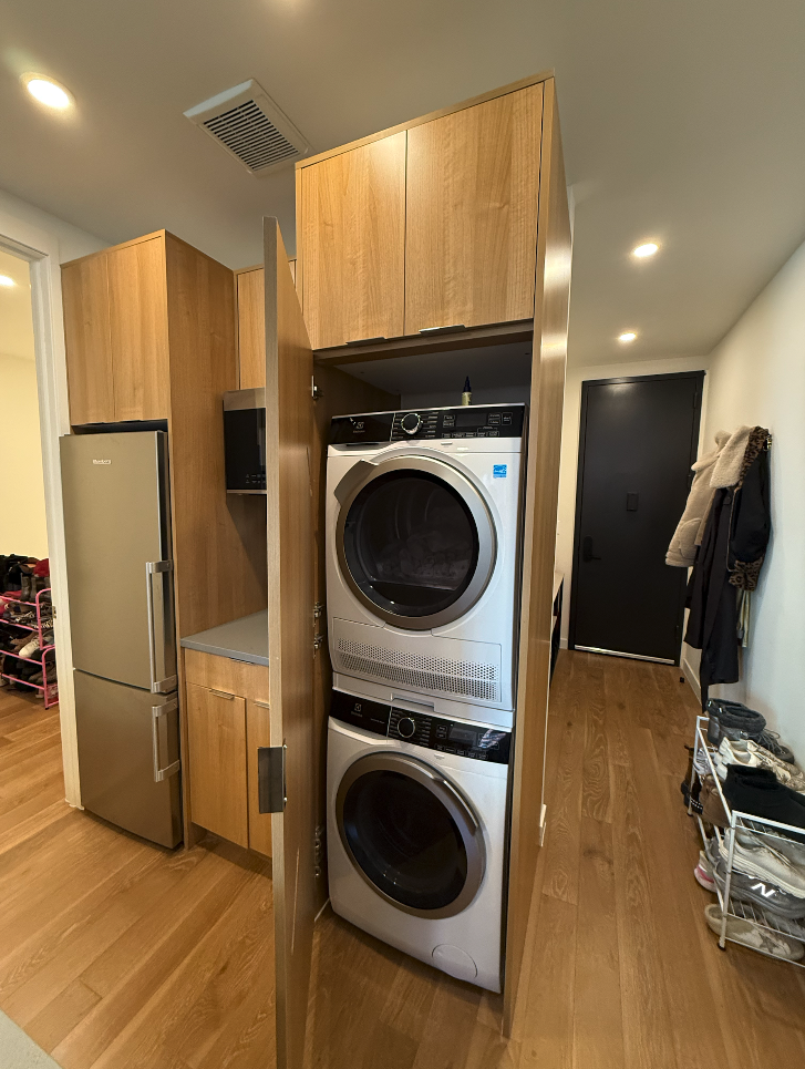 34 Carmine Street, Unit 2D Manhattan, NY 10014 - Photo 2 of 8 a view of a kitchen with a washer and dryer