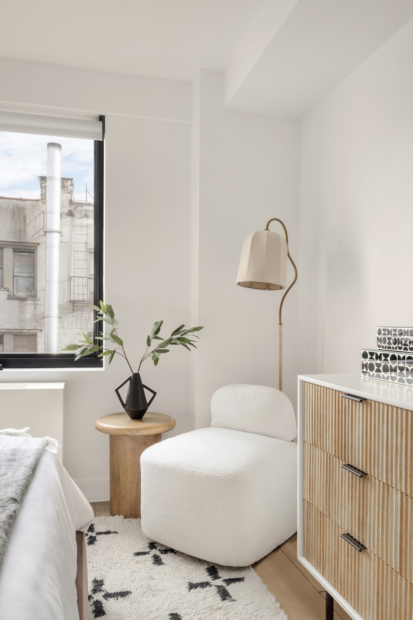 533 East 12th Street, Unit 6D Manhattan, NY 10009 - Photo 12 of 14 a living room with furniture a window and a chandelier