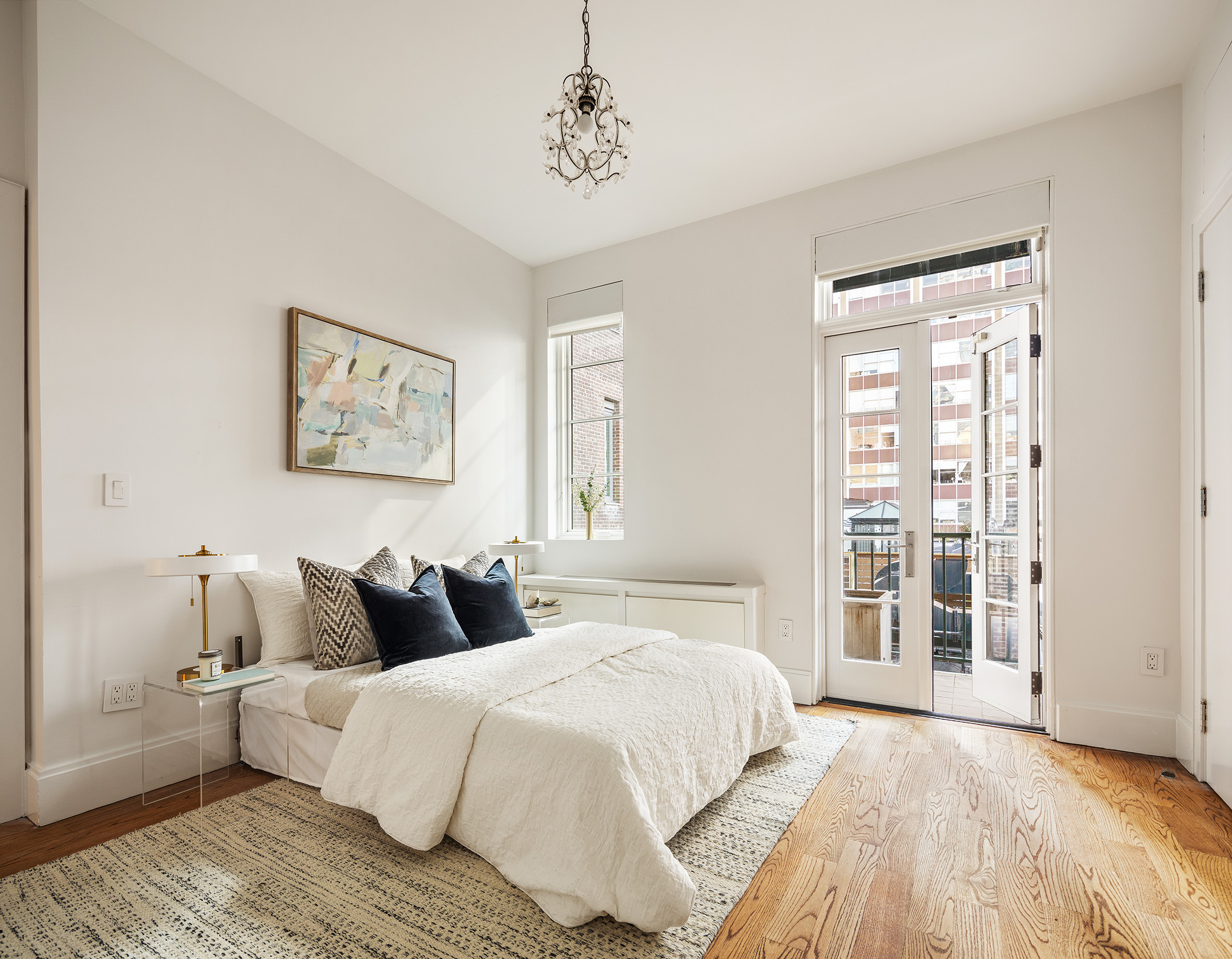 41 Warren Street, Unit 6 Manhattan, NY 10007 - Photo 15 of 23 a spacious bedroom with a large bed and a window
