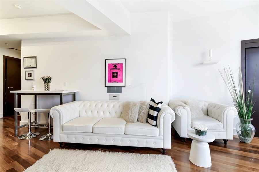 150 Myrtle Avenue, Unit 1902 Brooklyn, NY 11201 - Photo 2 of 27 a living room with furniture and wooden floor
