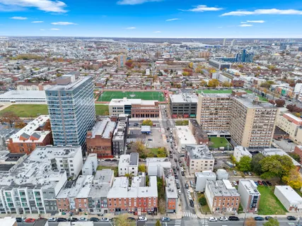 an aerial view of residential building and lake