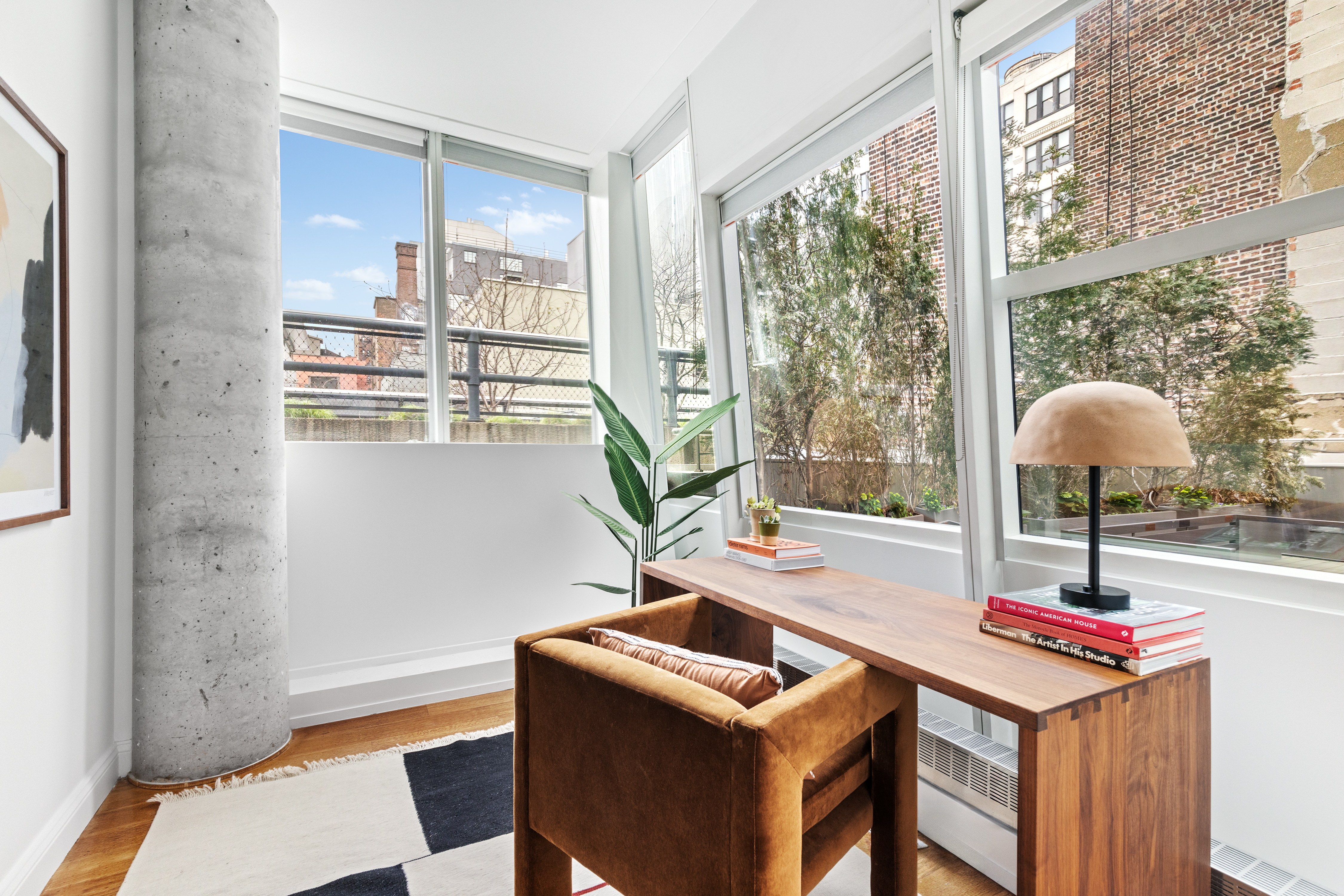 245 10th Avenue, Unit 2W Manhattan, NY 10001 - Photo 14 of 16 a room with furniture and window