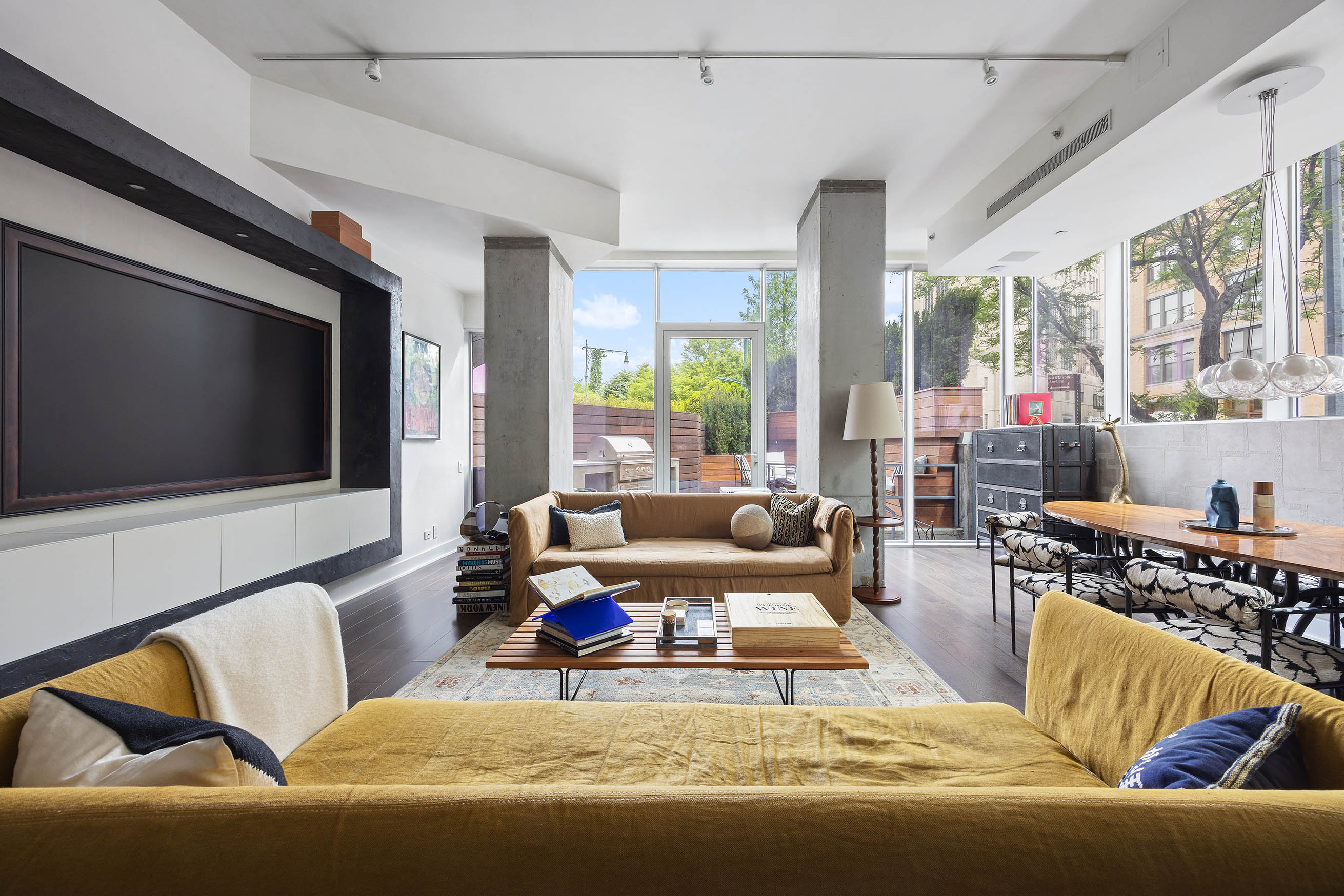 471 Washington Street, Unit THB Manhattan, NY 10013 - Photo 6 of 15 a living room with furniture and a flat screen tv